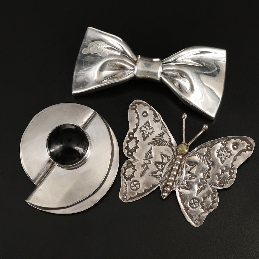 Sterling Brooches Including Signed Bow, Stampwork Butterfly and Round Mexican