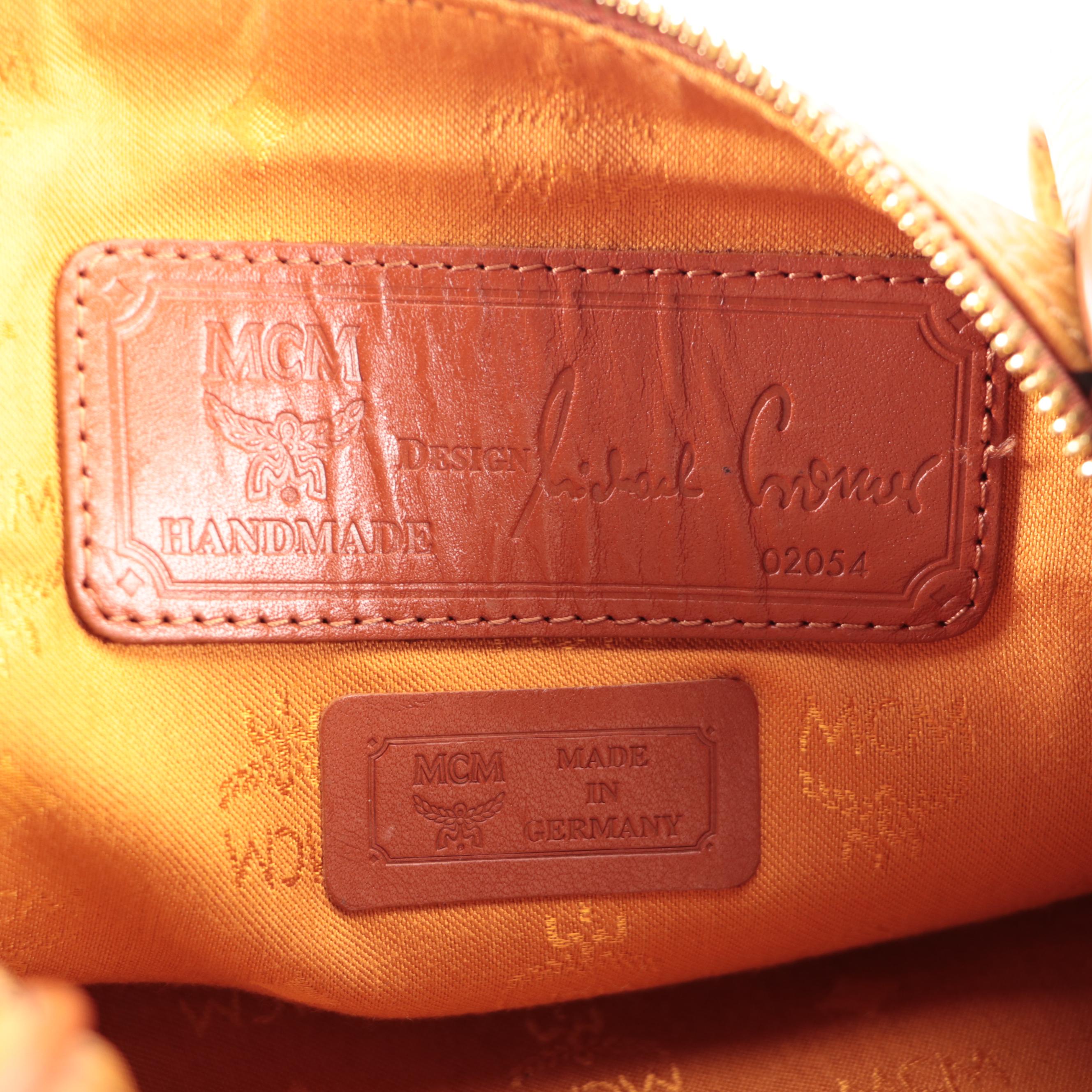 MCM Travel Bag in Cognac Monogram Visetos and Leather with Detachable Strap