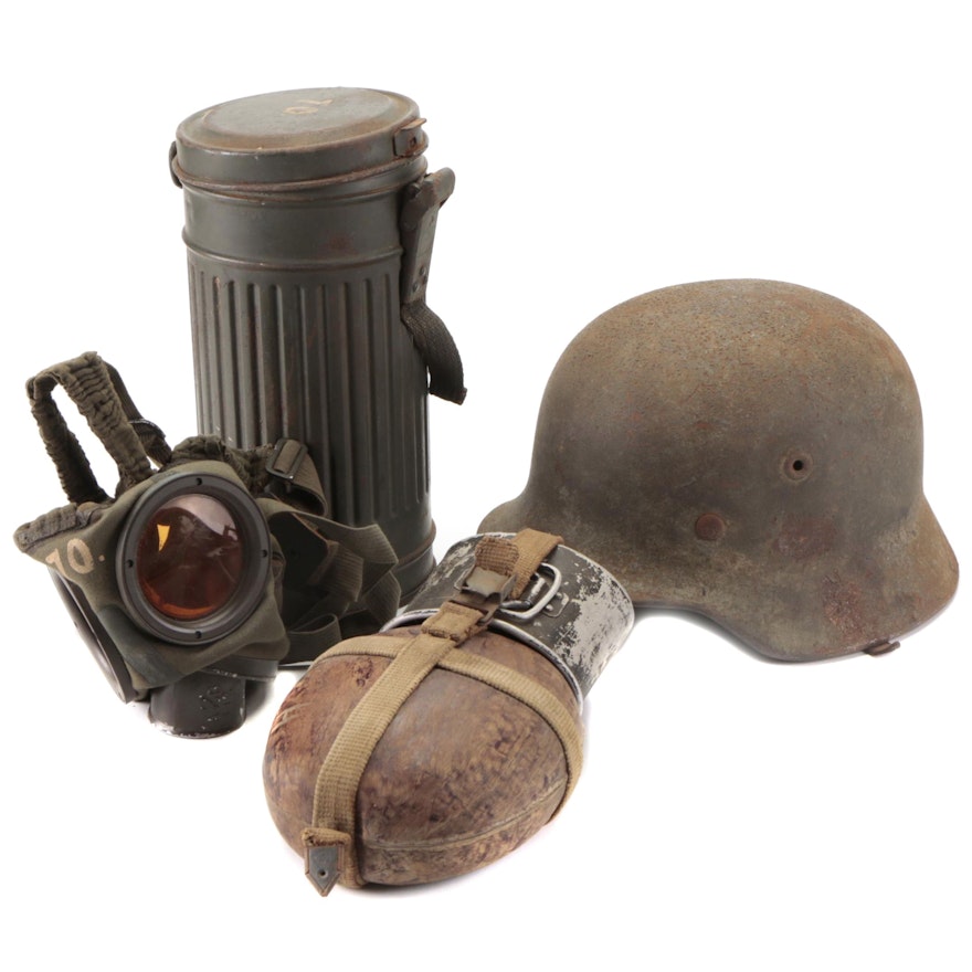 German WWII Era M35 Helmet, HRE43 Canteen, and Gas Mask, 1930s-1940s