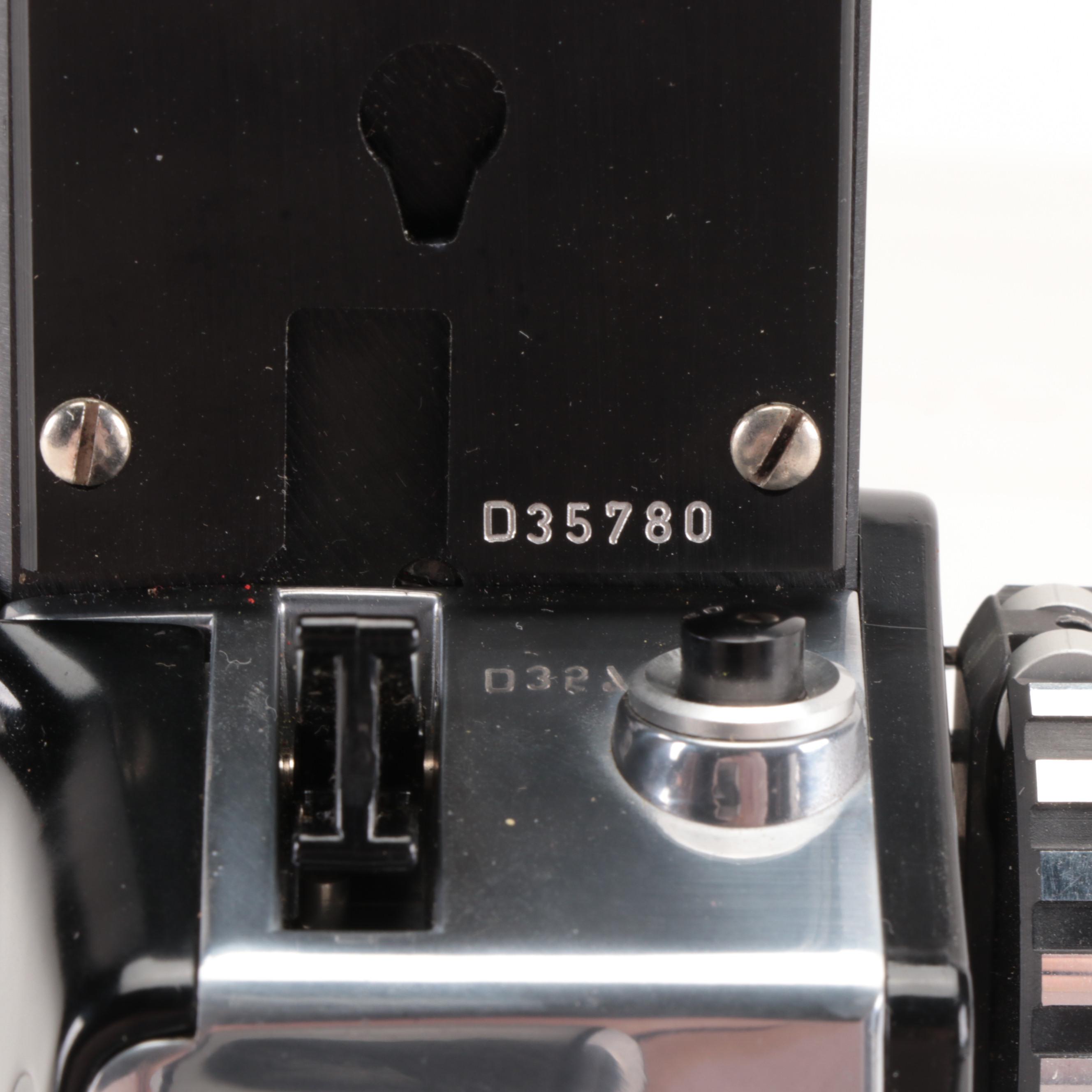 Bolex Paillard with Bell Howell Movie Cameras and Polaroid "95A" Land Camera