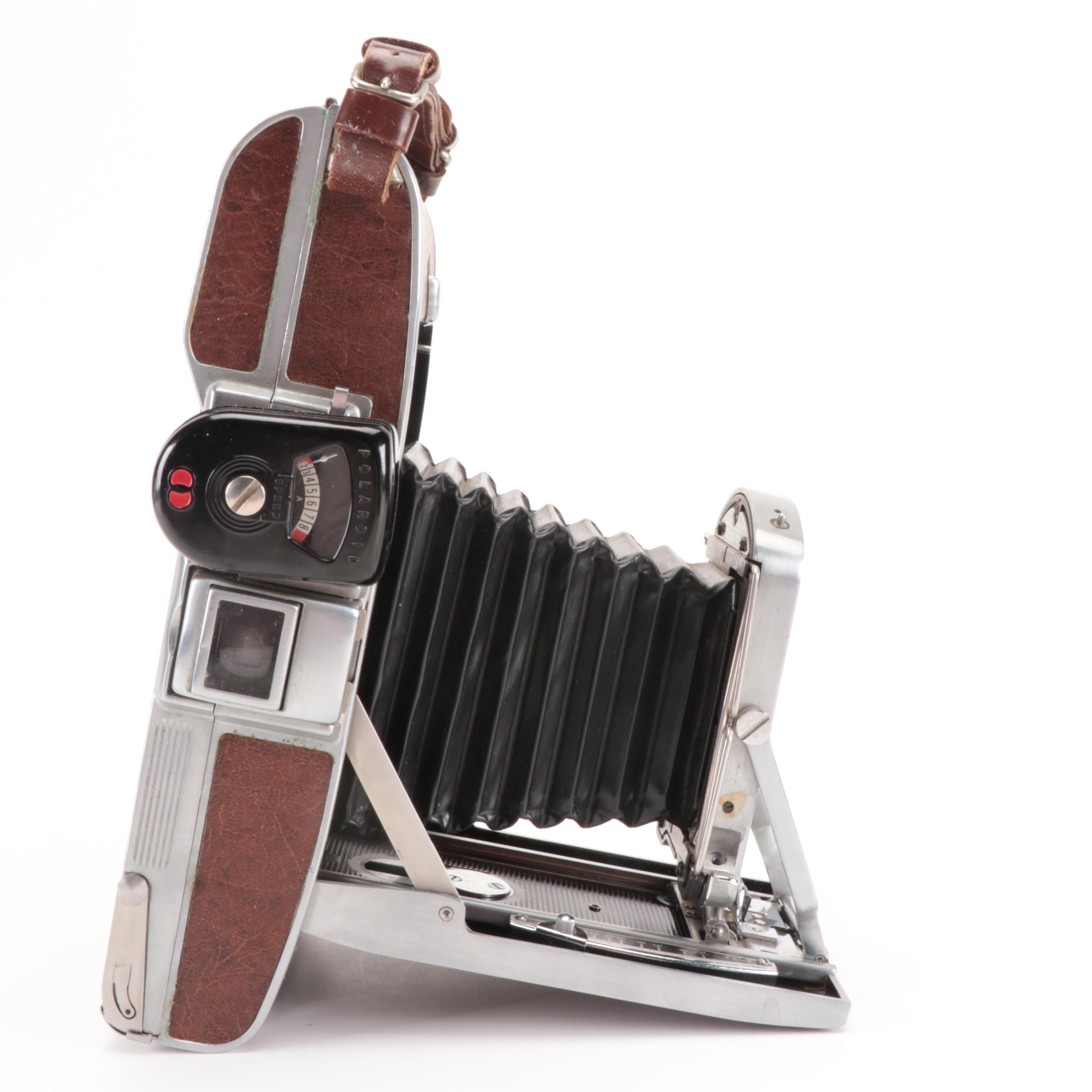 Bolex Paillard with Bell Howell Movie Cameras and Polaroid "95A" Land Camera