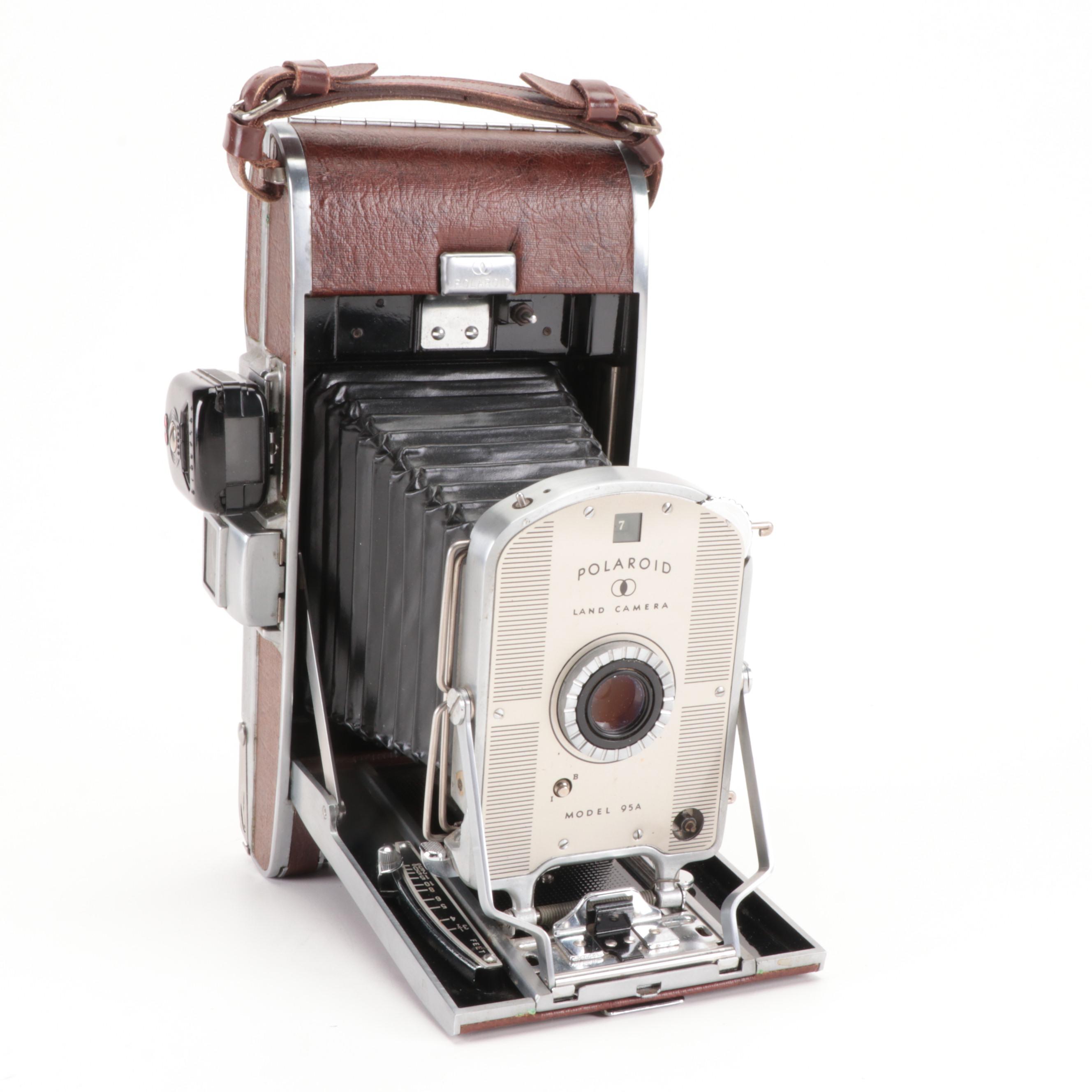 Bolex Paillard with Bell Howell Movie Cameras and Polaroid "95A" Land Camera