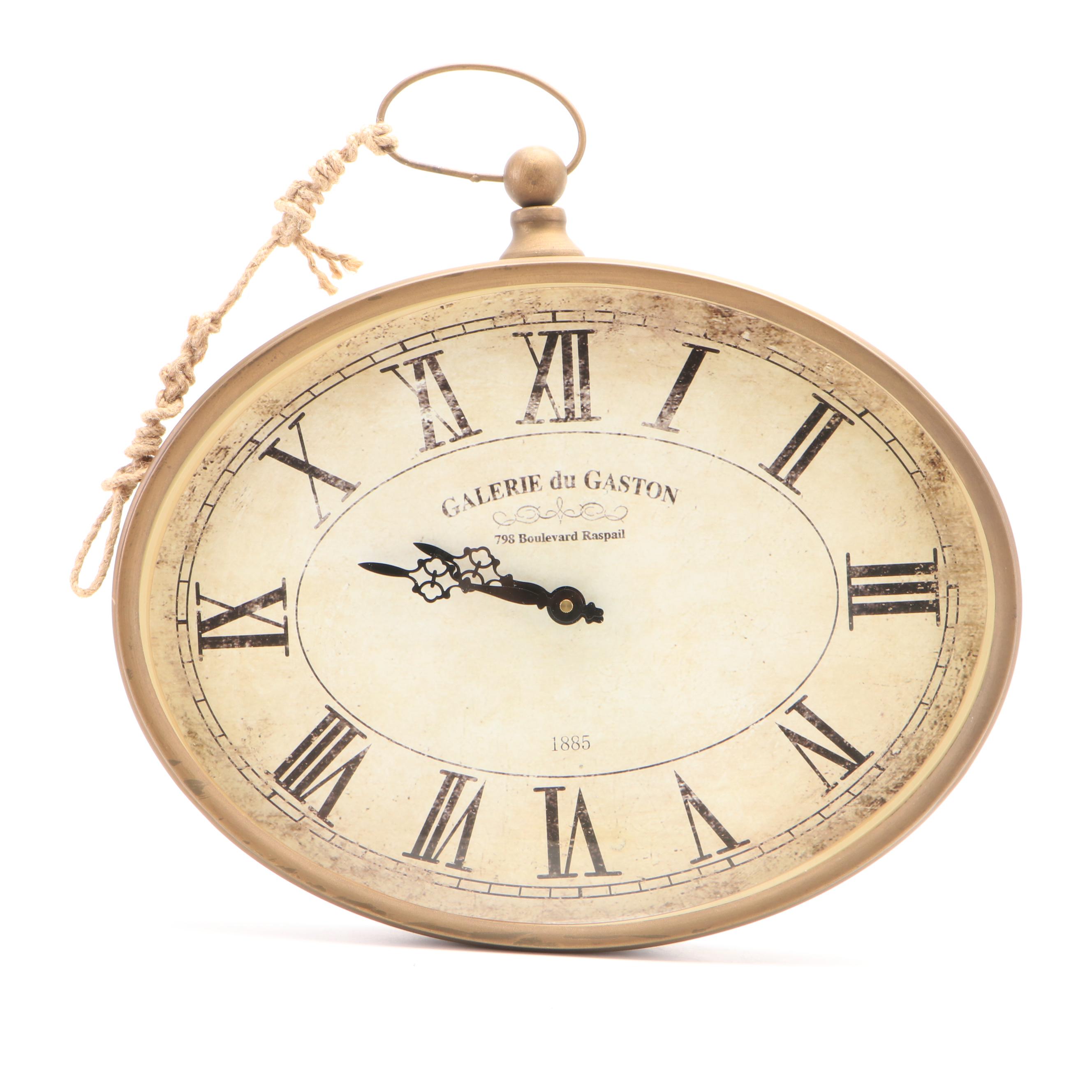 Oval Wall Clock with Cast Metal Brackets and Wooden Decor