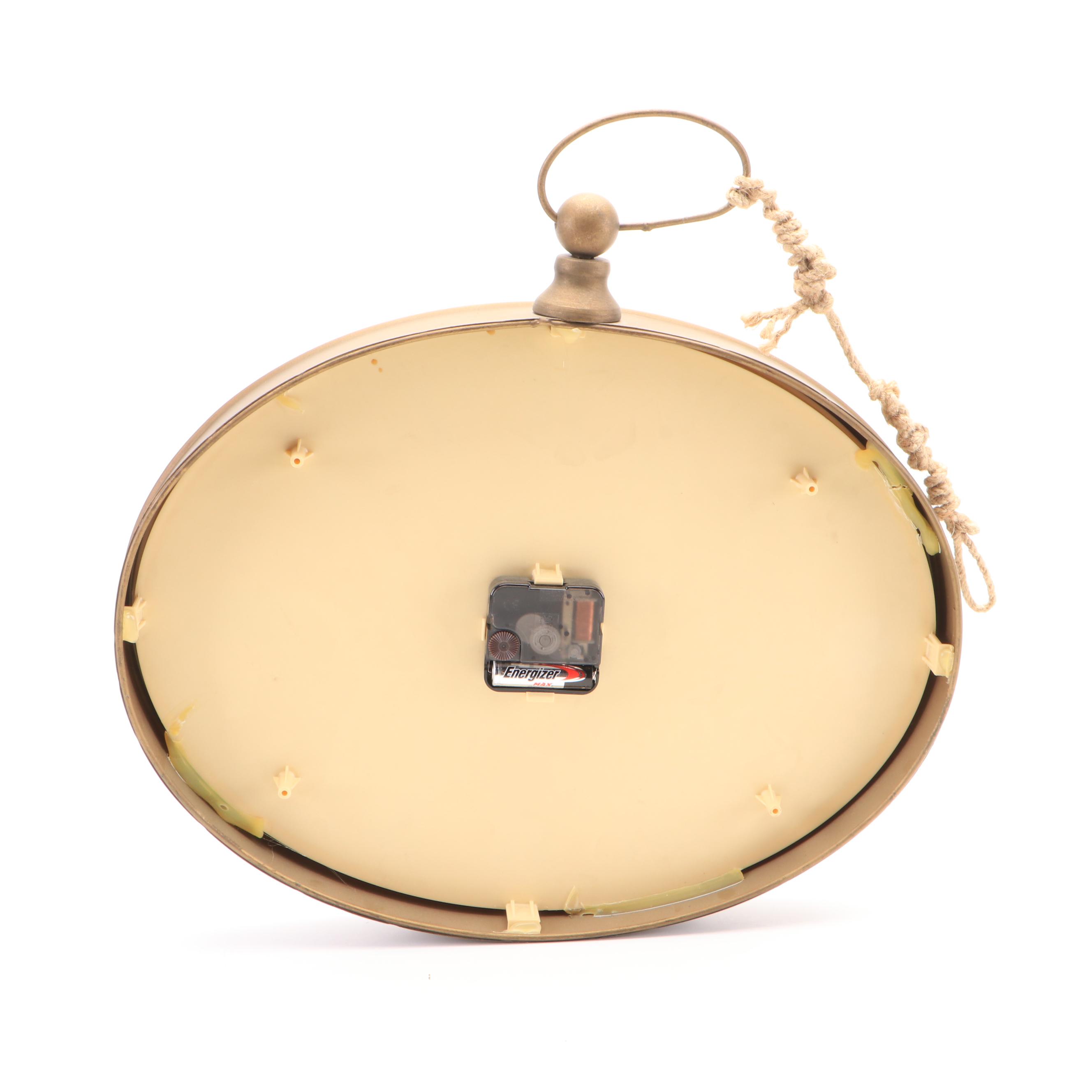 Oval Wall Clock with Cast Metal Brackets and Wooden Decor