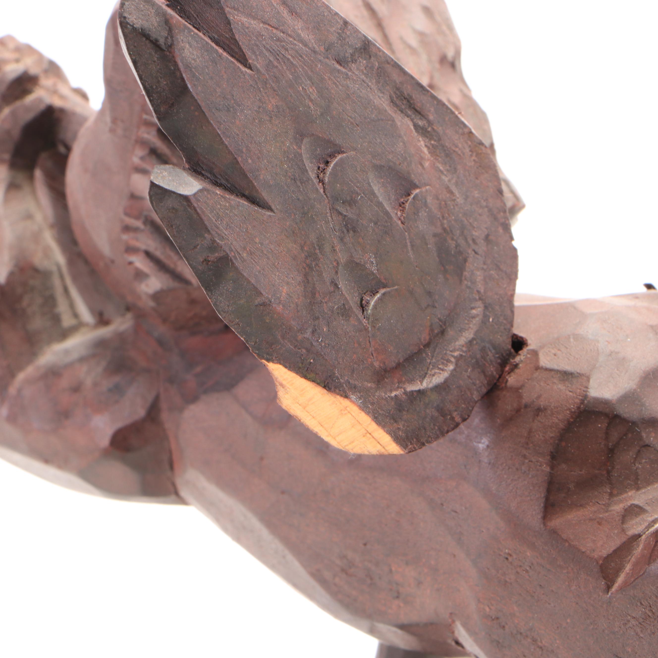 Oval Wall Clock with Cast Metal Brackets and Wooden Decor