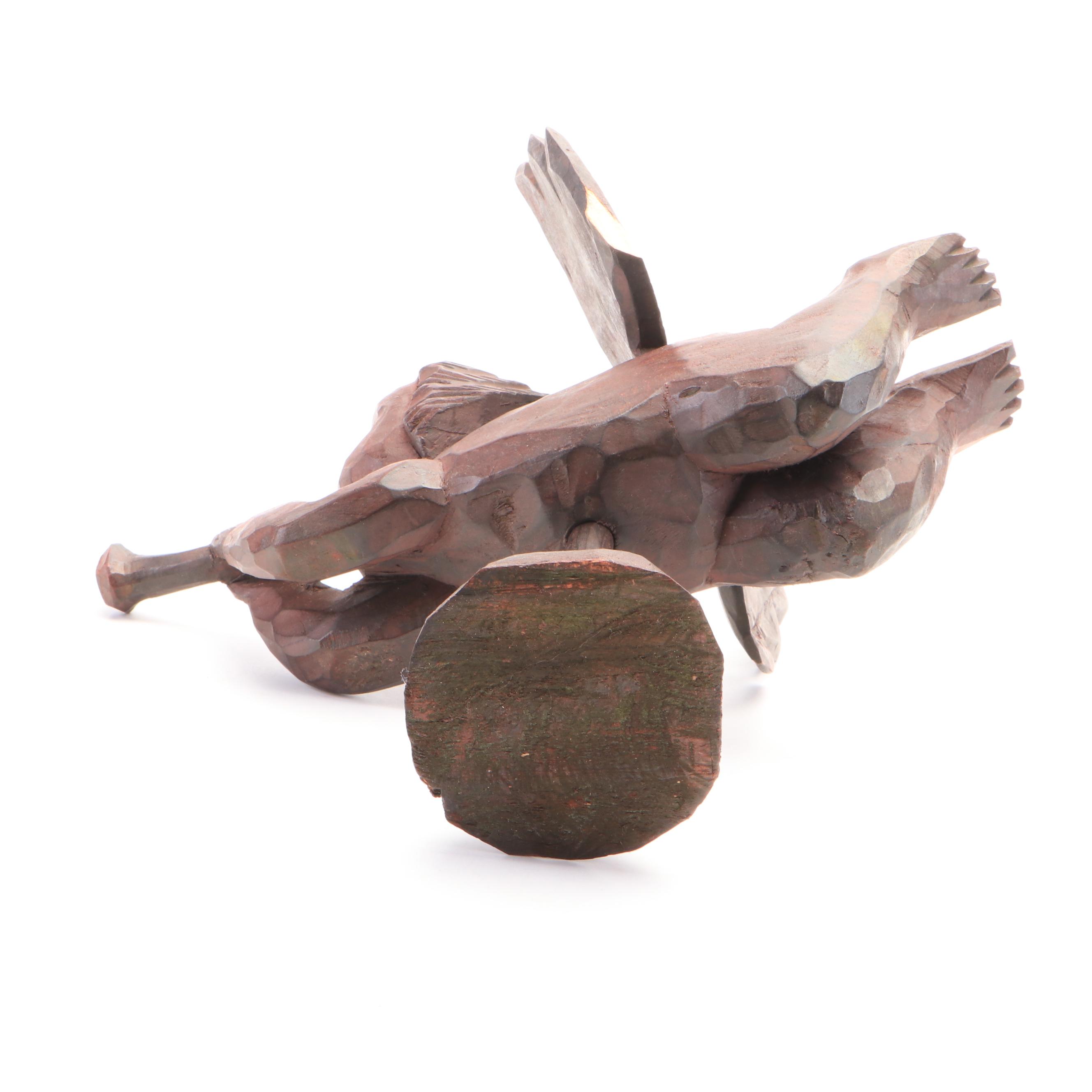 Oval Wall Clock with Cast Metal Brackets and Wooden Decor