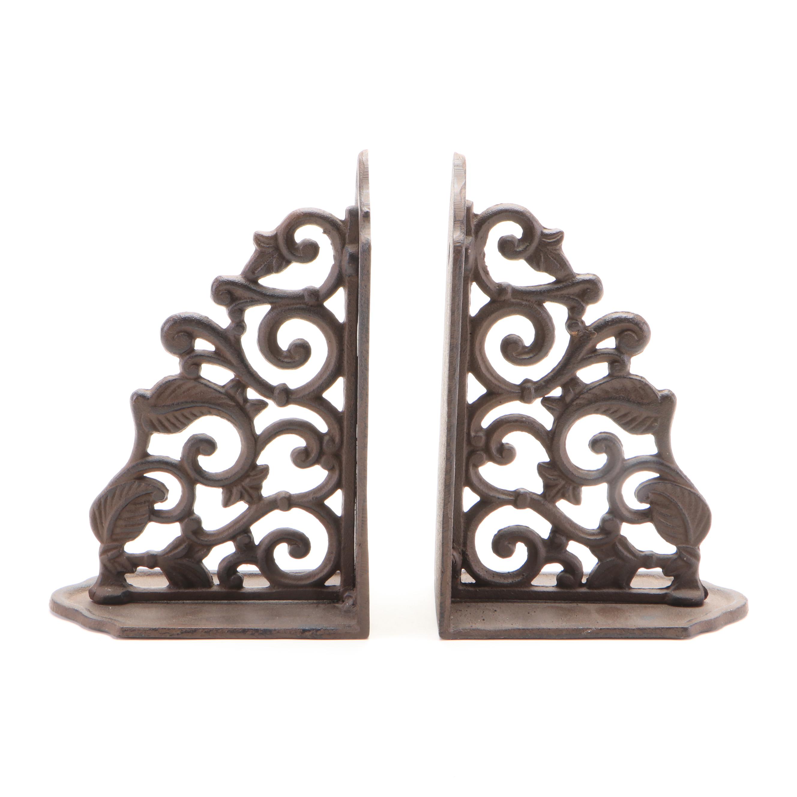 Oval Wall Clock with Cast Metal Brackets and Wooden Decor