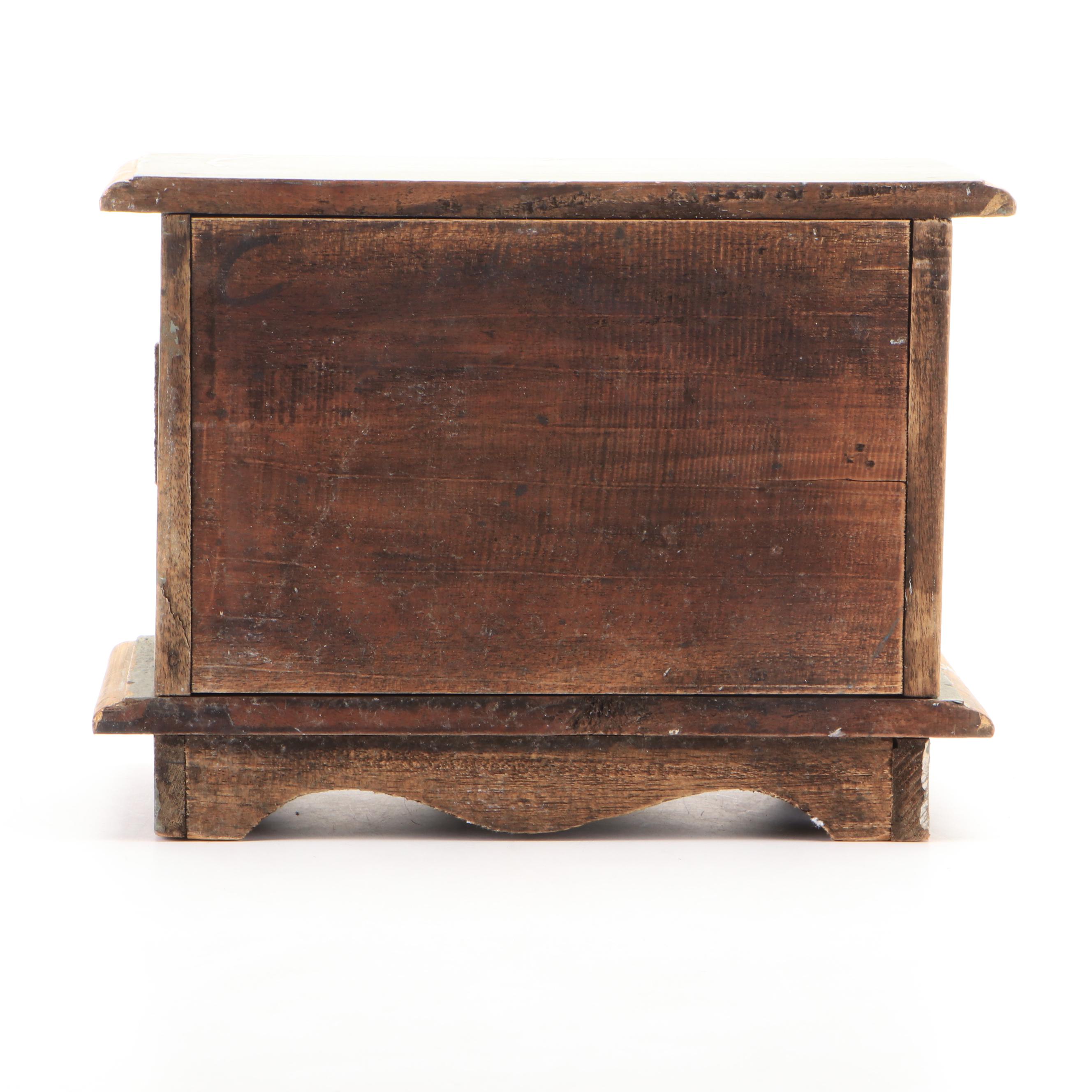 Oval Wall Clock with Cast Metal Brackets and Wooden Decor