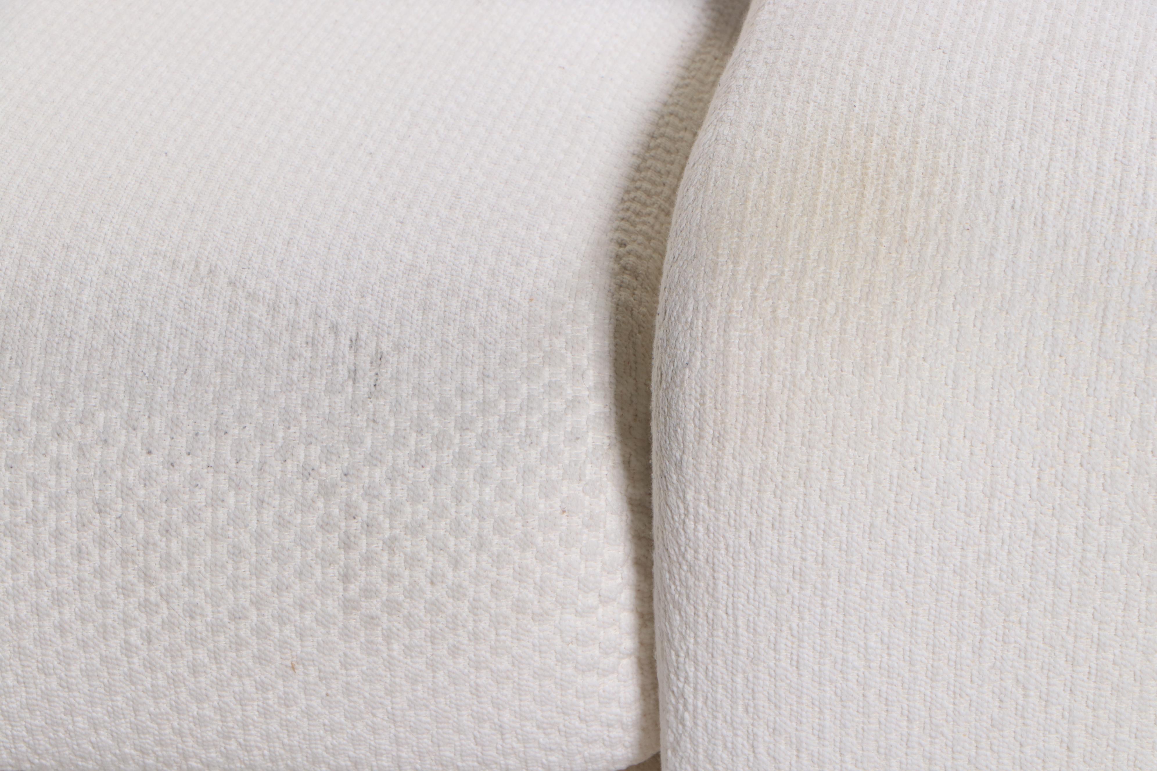 Krispin's Three-Piece Sectional Sofa in Cream Textured Fabric Upholstery