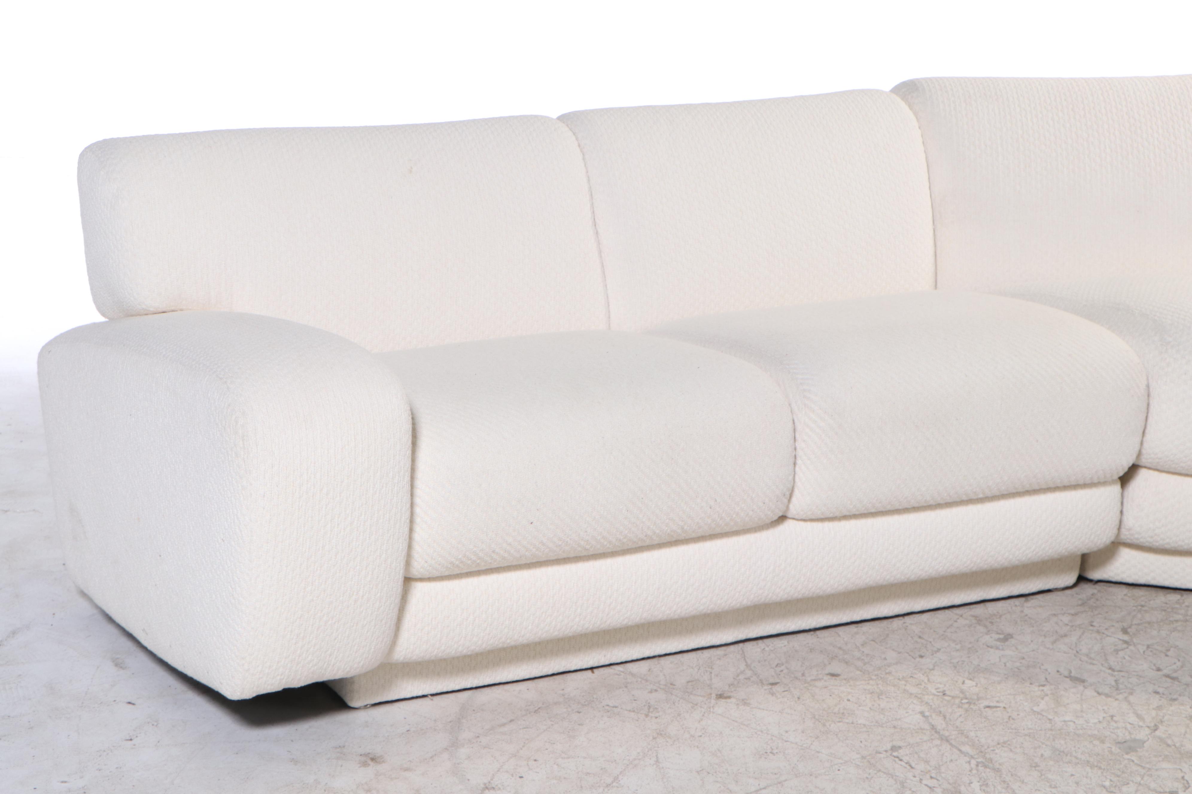 Krispin's Three-Piece Sectional Sofa in Cream Textured Fabric Upholstery