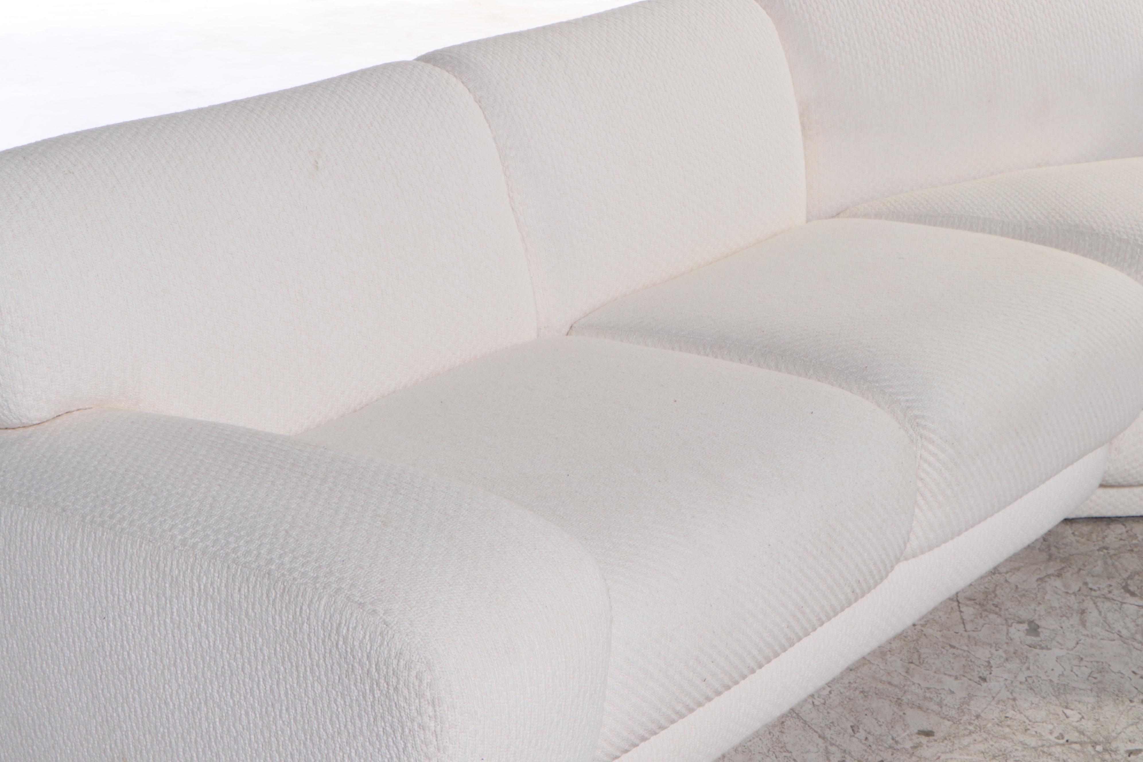 Krispin's Three-Piece Sectional Sofa in Cream Textured Fabric Upholstery