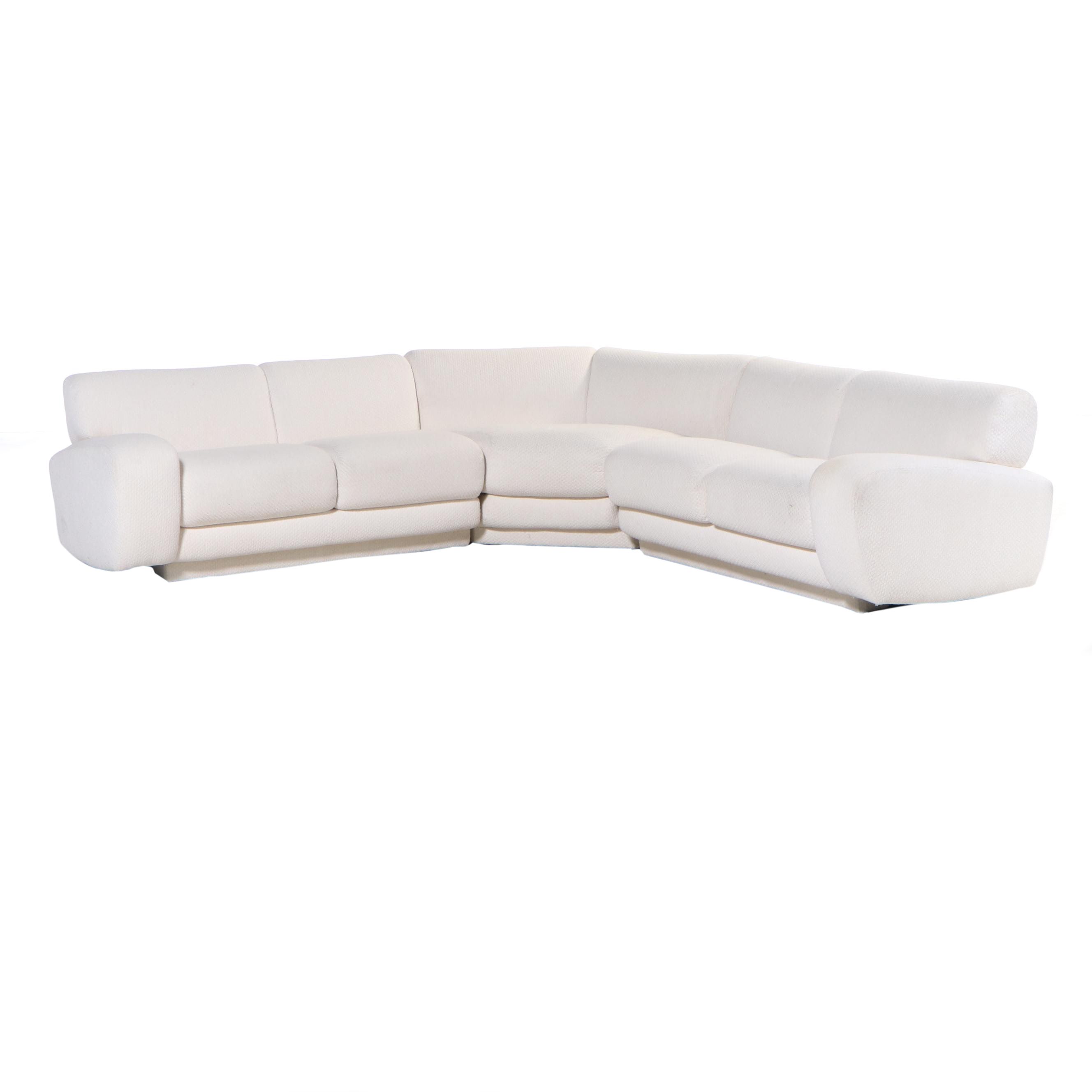 Krispin's Three-Piece Sectional Sofa in Cream Textured Fabric Upholstery