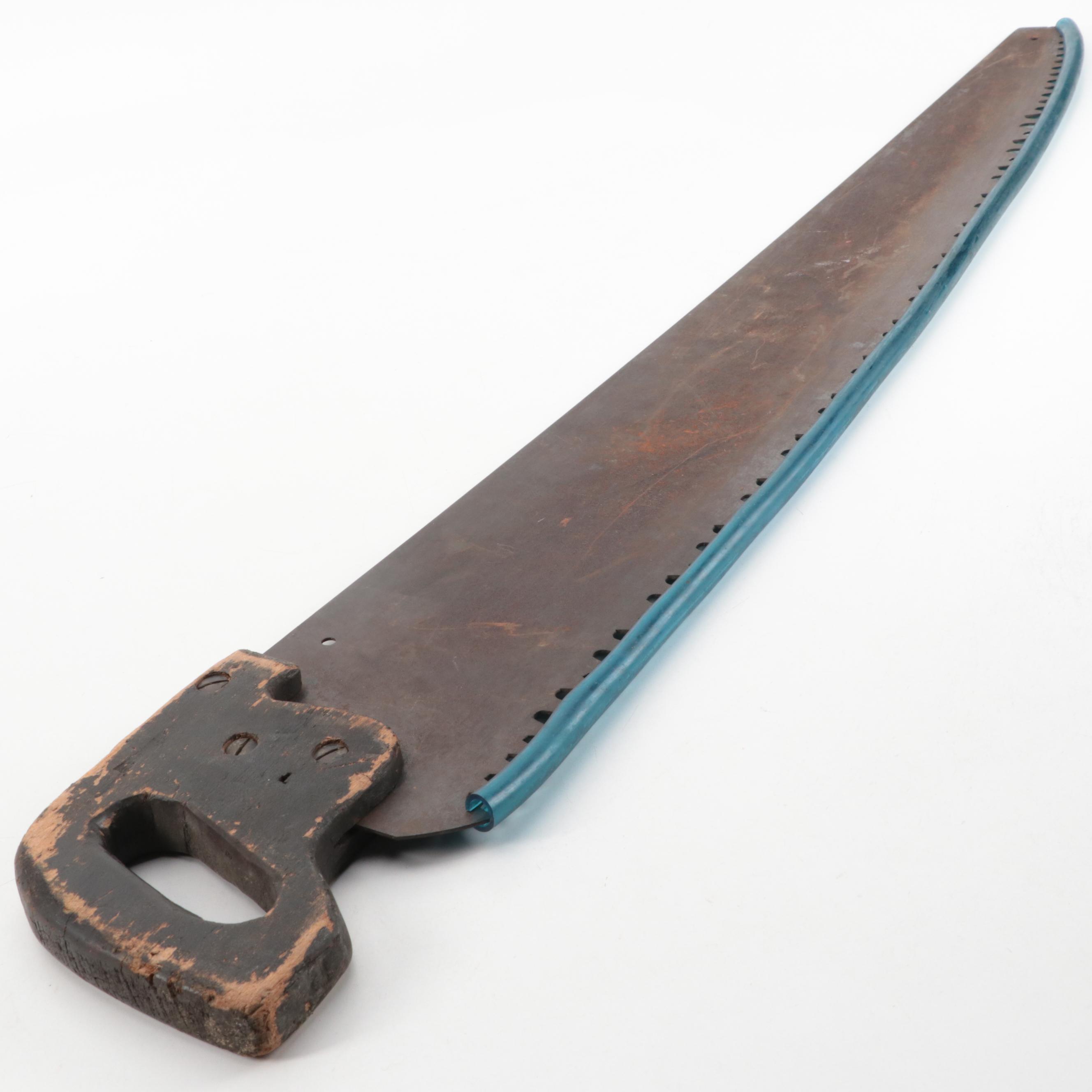 Large Cast Iron Wrench and Warranted Superior Metal Hand Saw with Wood Handle
