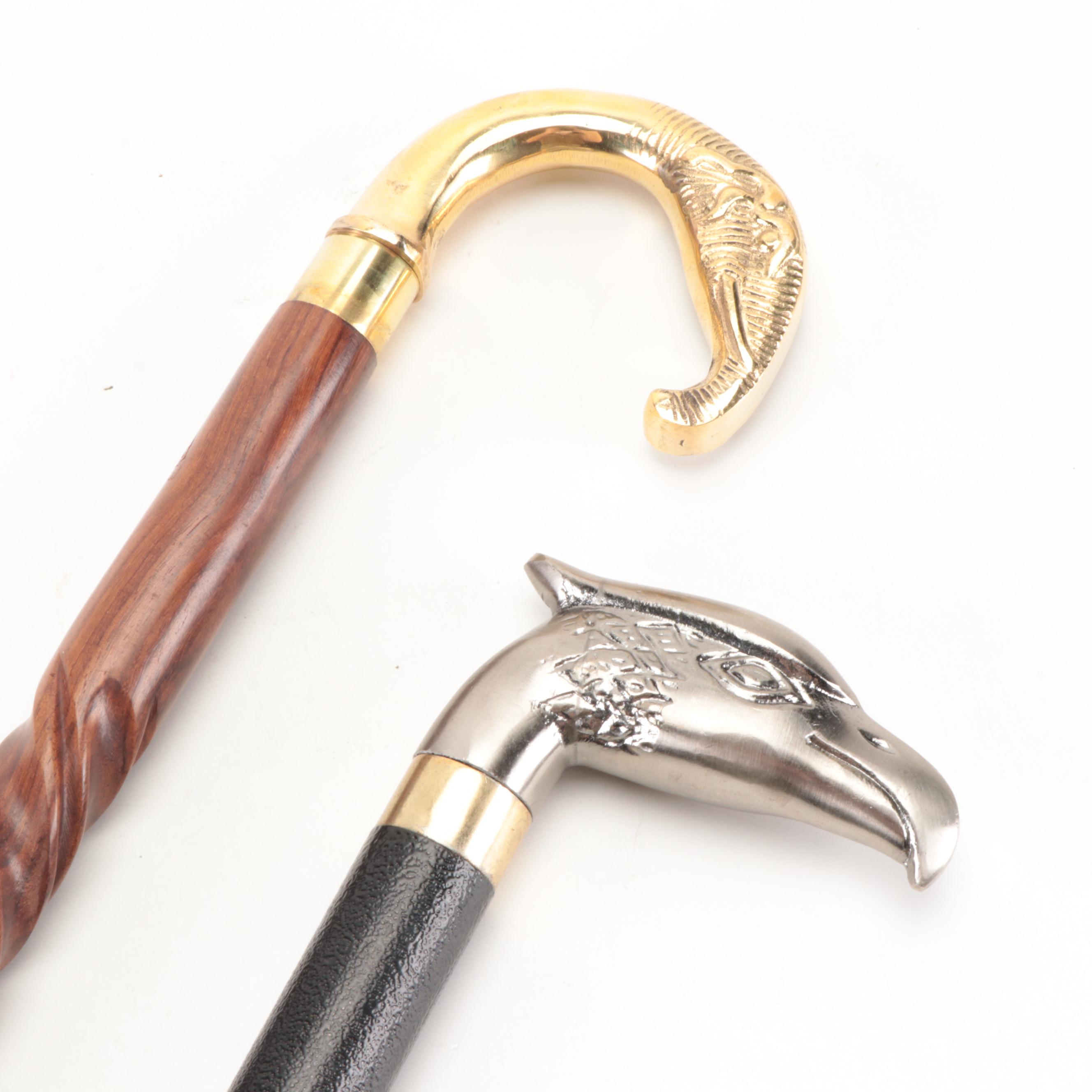 Brushed Metal Eagle Head Sword Cane With Lacquered Brass Elephant Head Cane