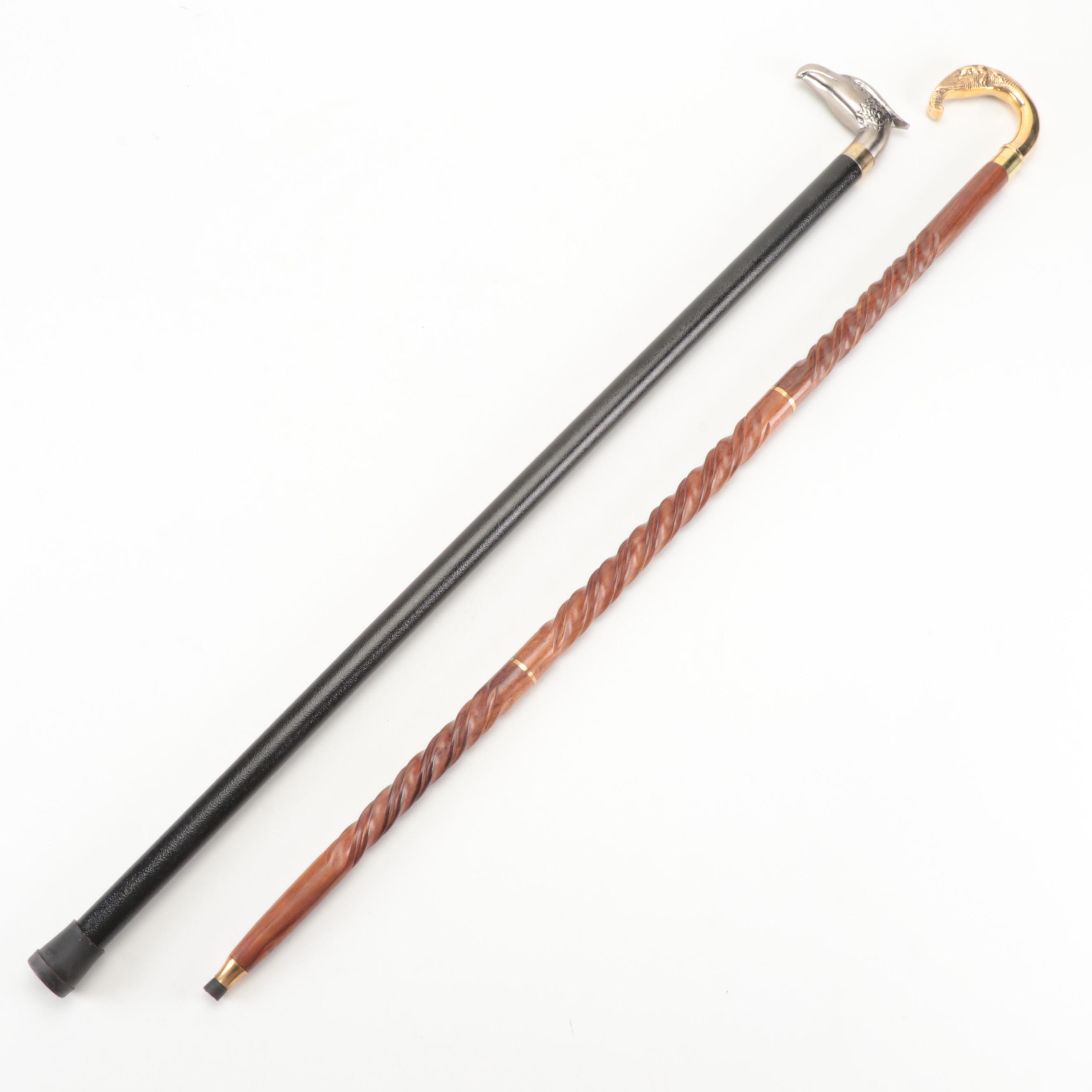 Brushed Metal Eagle Head Sword Cane With Lacquered Brass Elephant Head Cane