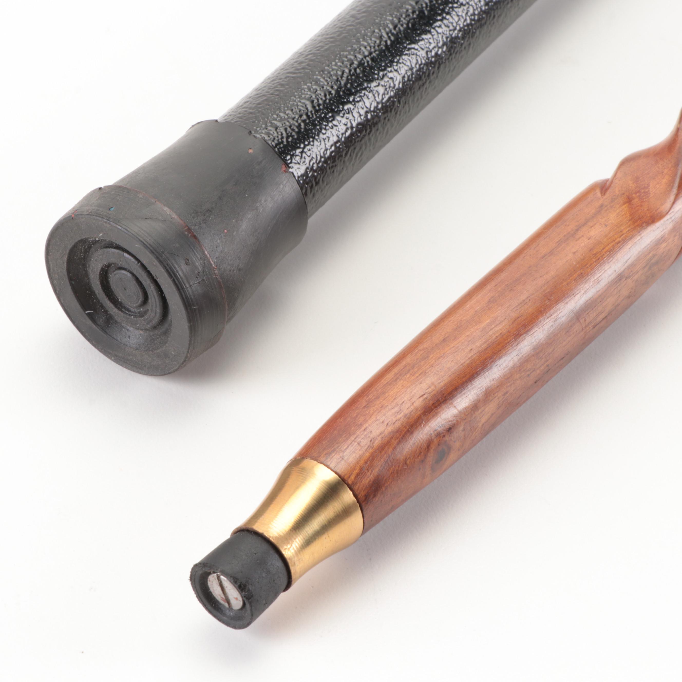 Brushed Metal Eagle Head Sword Cane With Lacquered Brass Elephant Head Cane