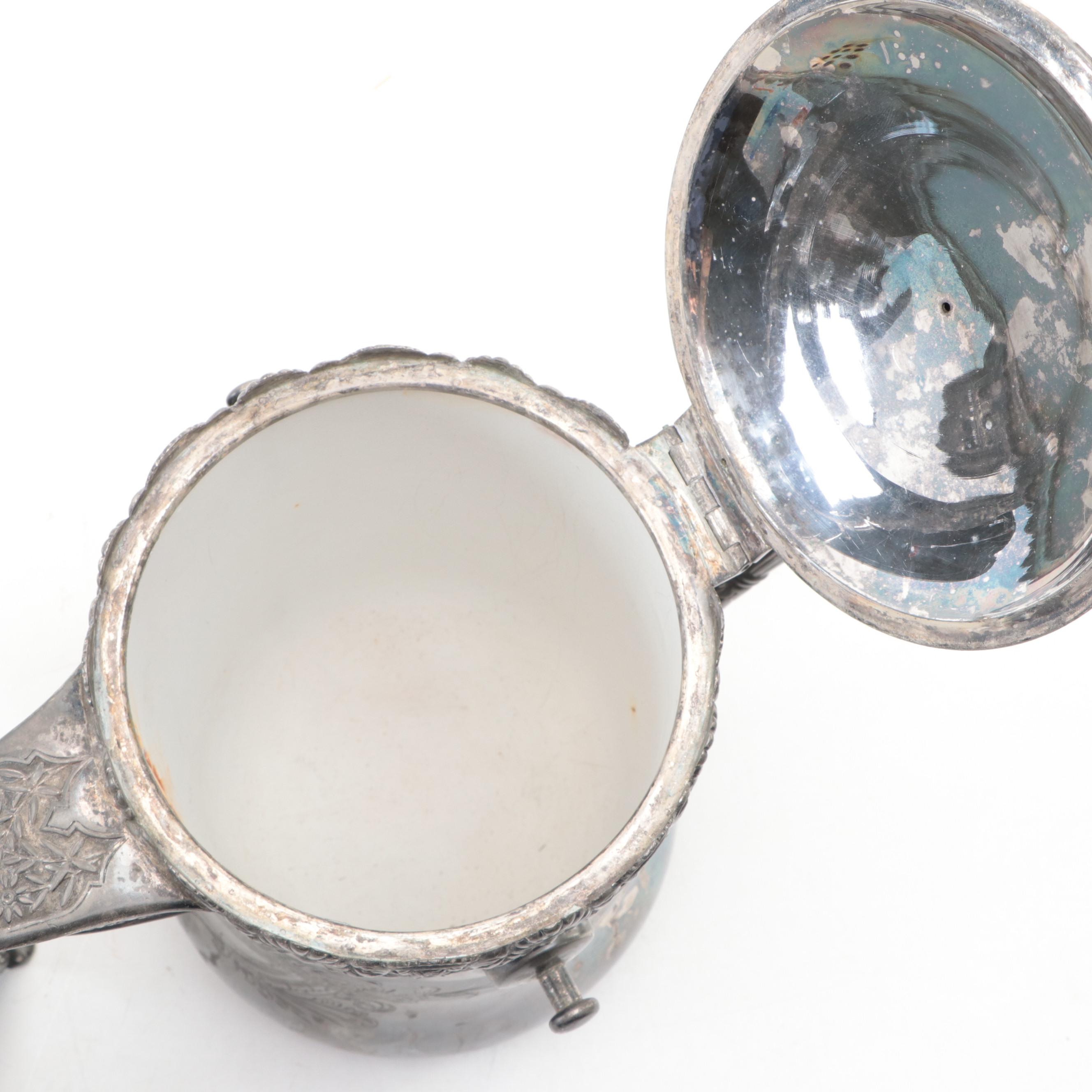 Barbour Silver Co. Tilting Water Pitcher with Other Silver Plate Tableware