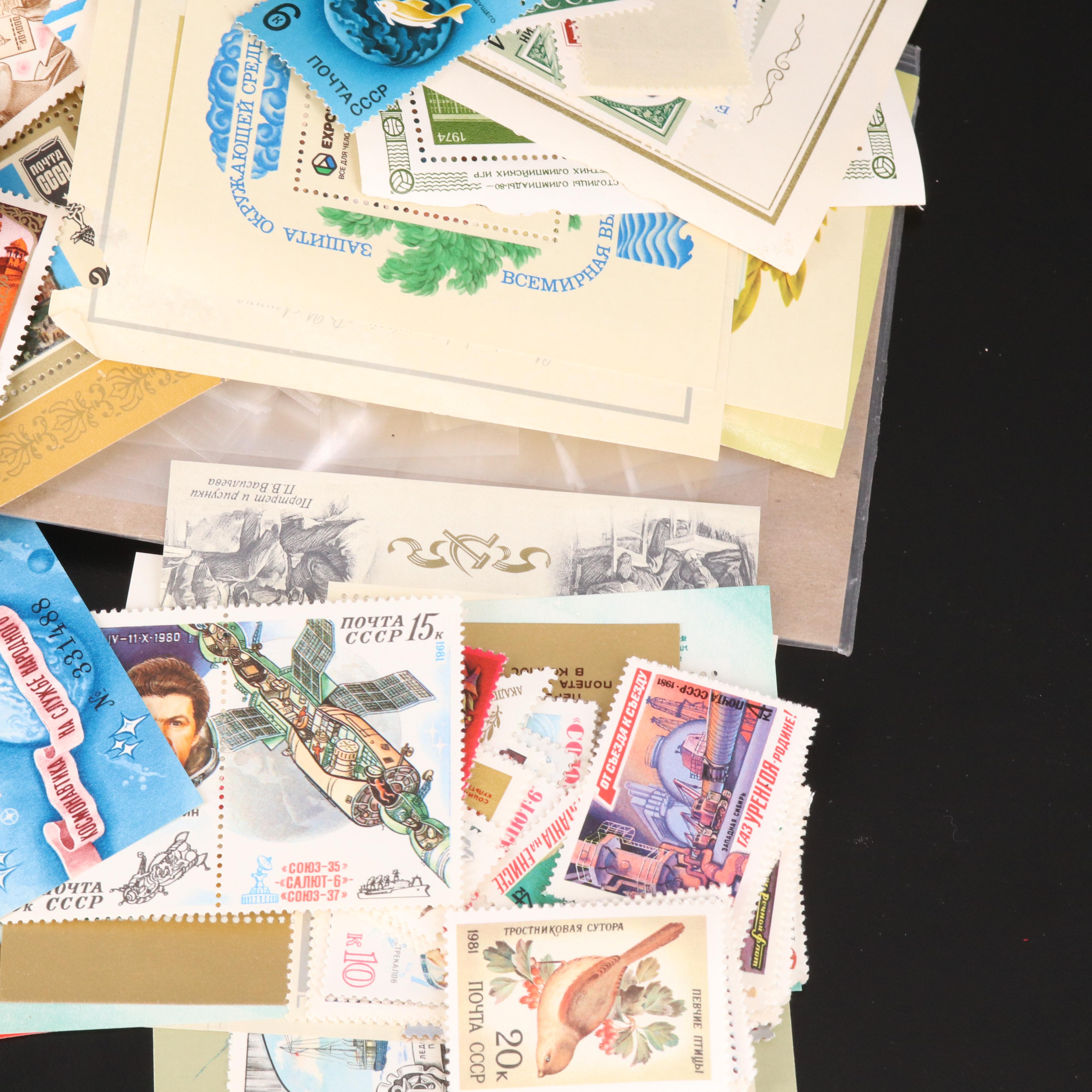 Assortment of Stamp Mounts and Soviet Union Postage Stamps