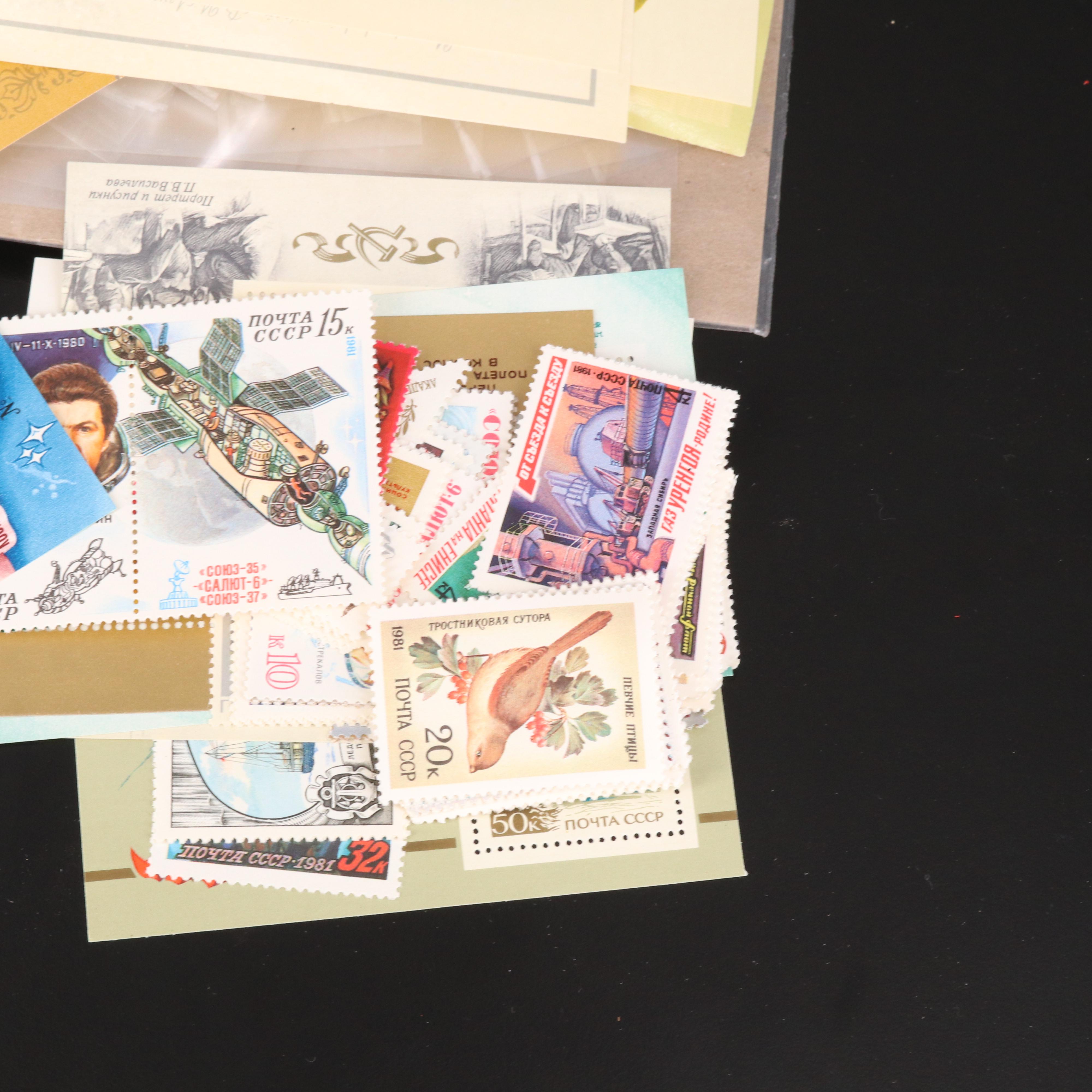 Assortment of Stamp Mounts and Soviet Union Postage Stamps