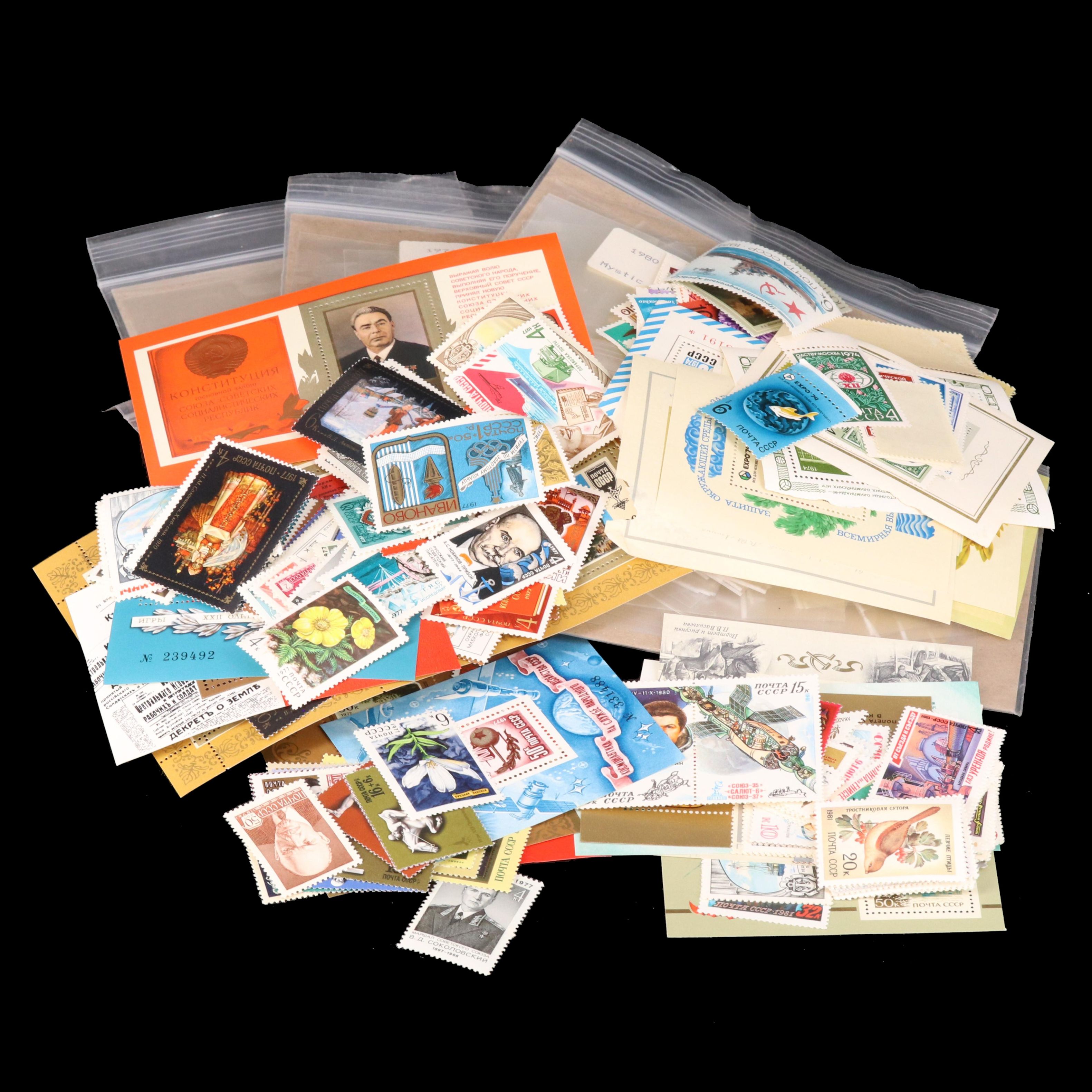 Assortment of Stamp Mounts and Soviet Union Postage Stamps