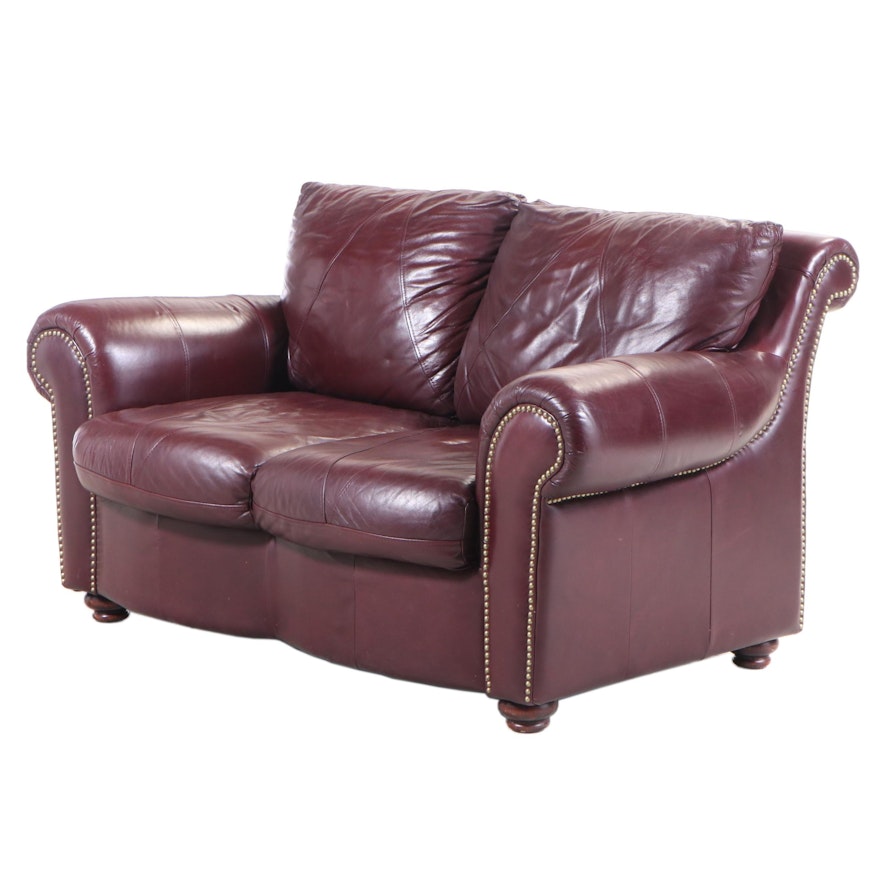 Sealy Leather and Brass-Tacked Loveseat Sofa with Attached Cushions