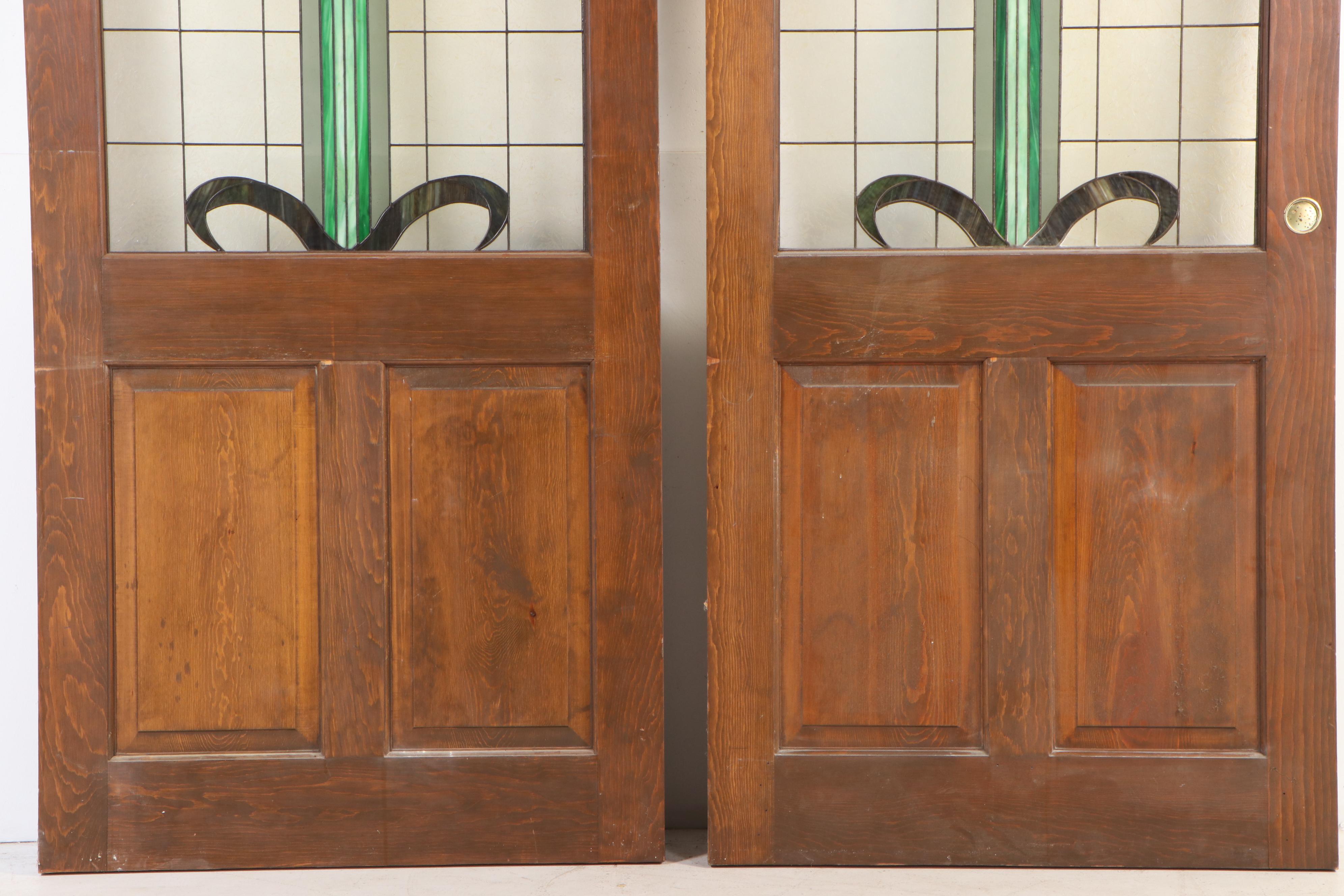 Pair of Fir Pocket Doors with Arched Leaded Stained and Slag Glass Windows