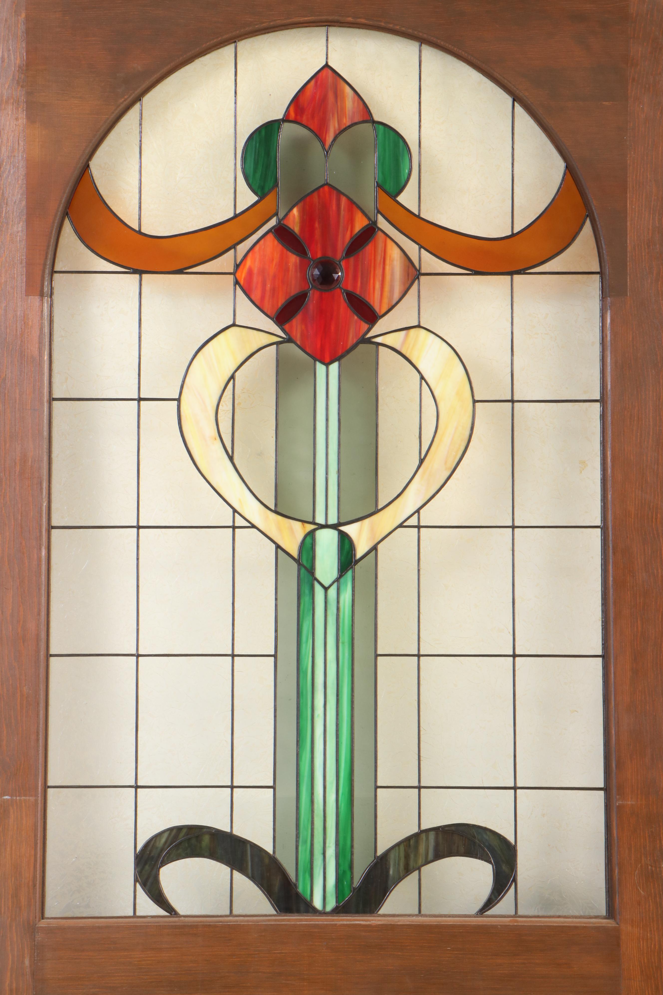 Pair of Fir Pocket Doors with Arched Leaded Stained and Slag Glass Windows