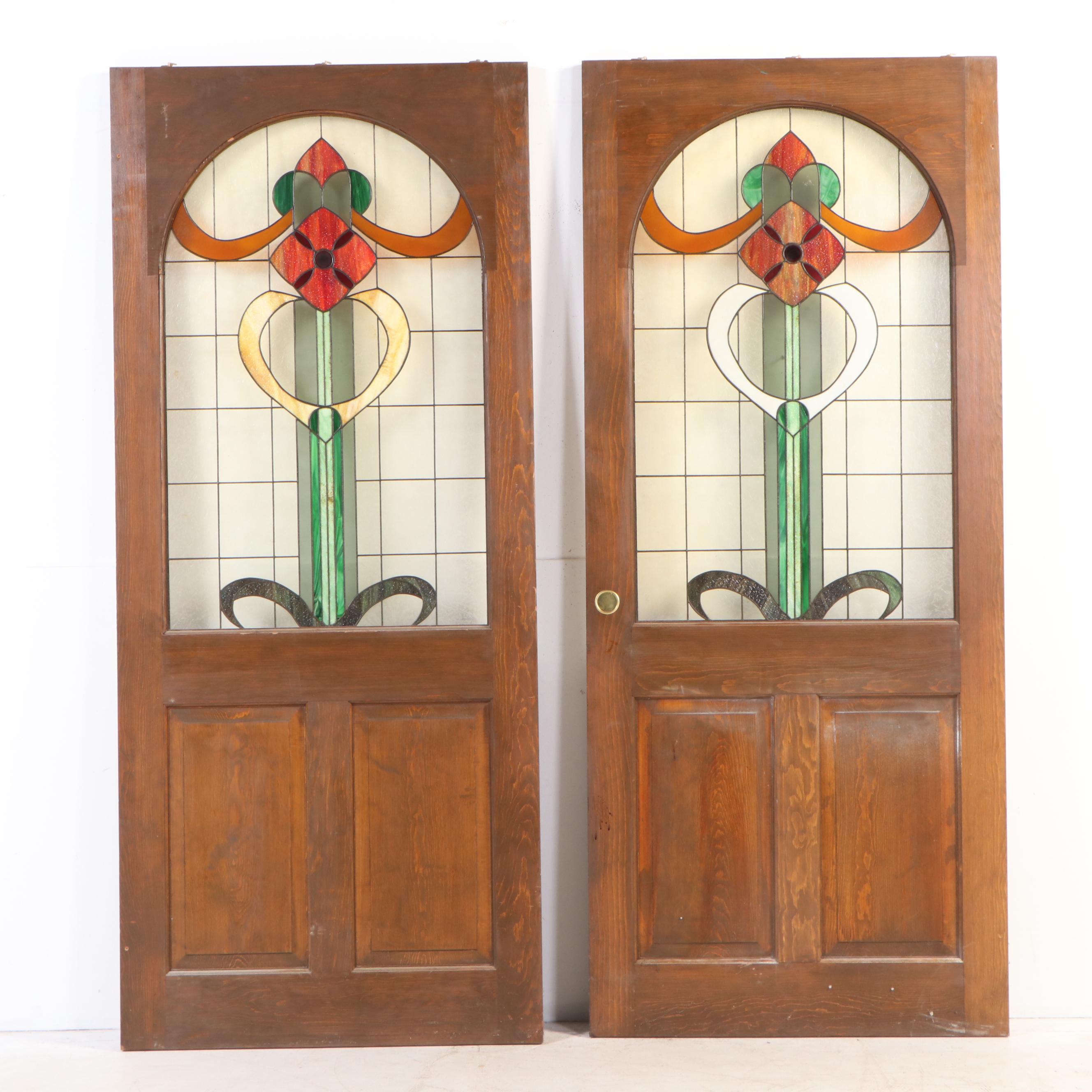 Pair of Fir Pocket Doors with Arched Leaded Stained and Slag Glass Windows