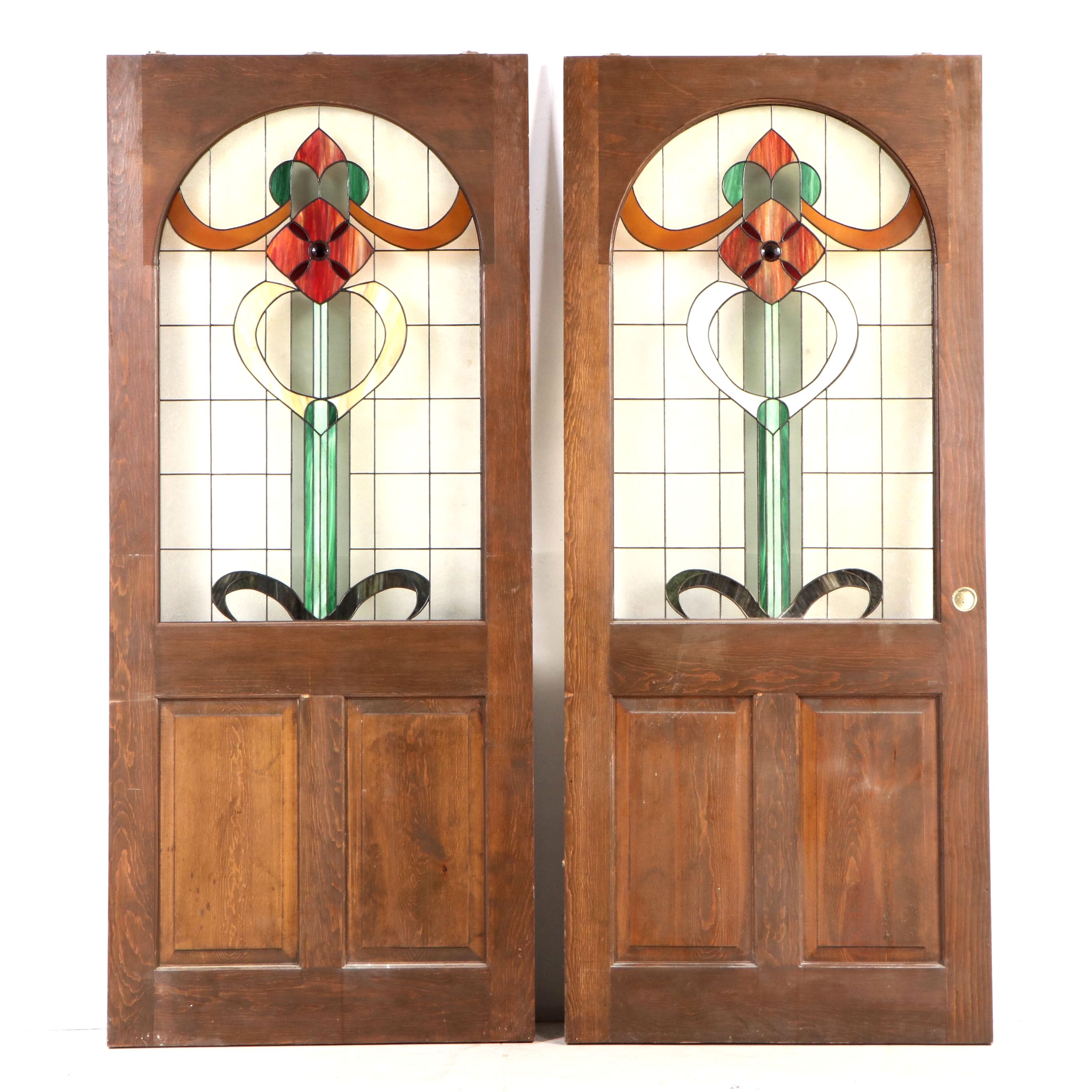 Pair of Fir Pocket Doors with Arched Leaded Stained and Slag Glass Windows