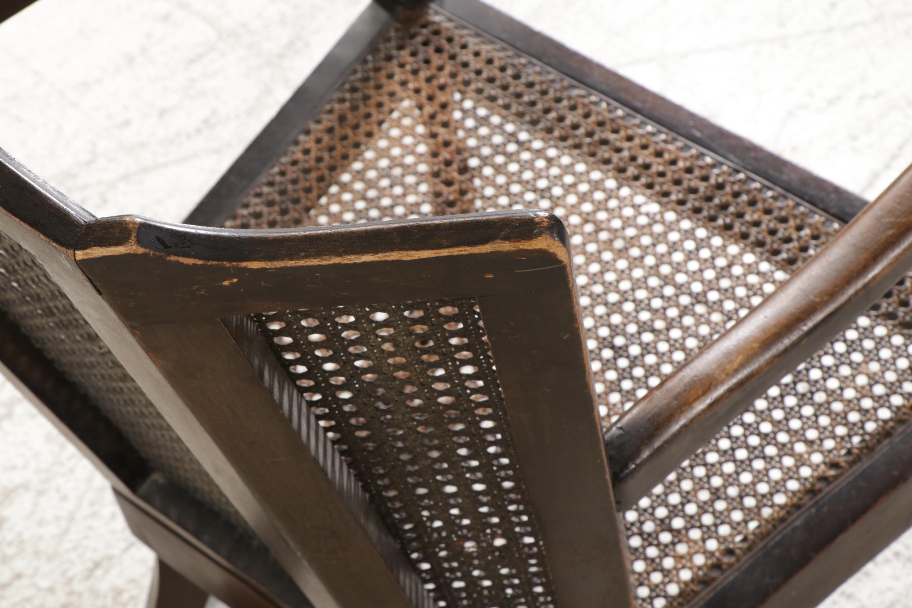 Queen Anne Style Ebonized and Caned Wingback Rocking Armchair