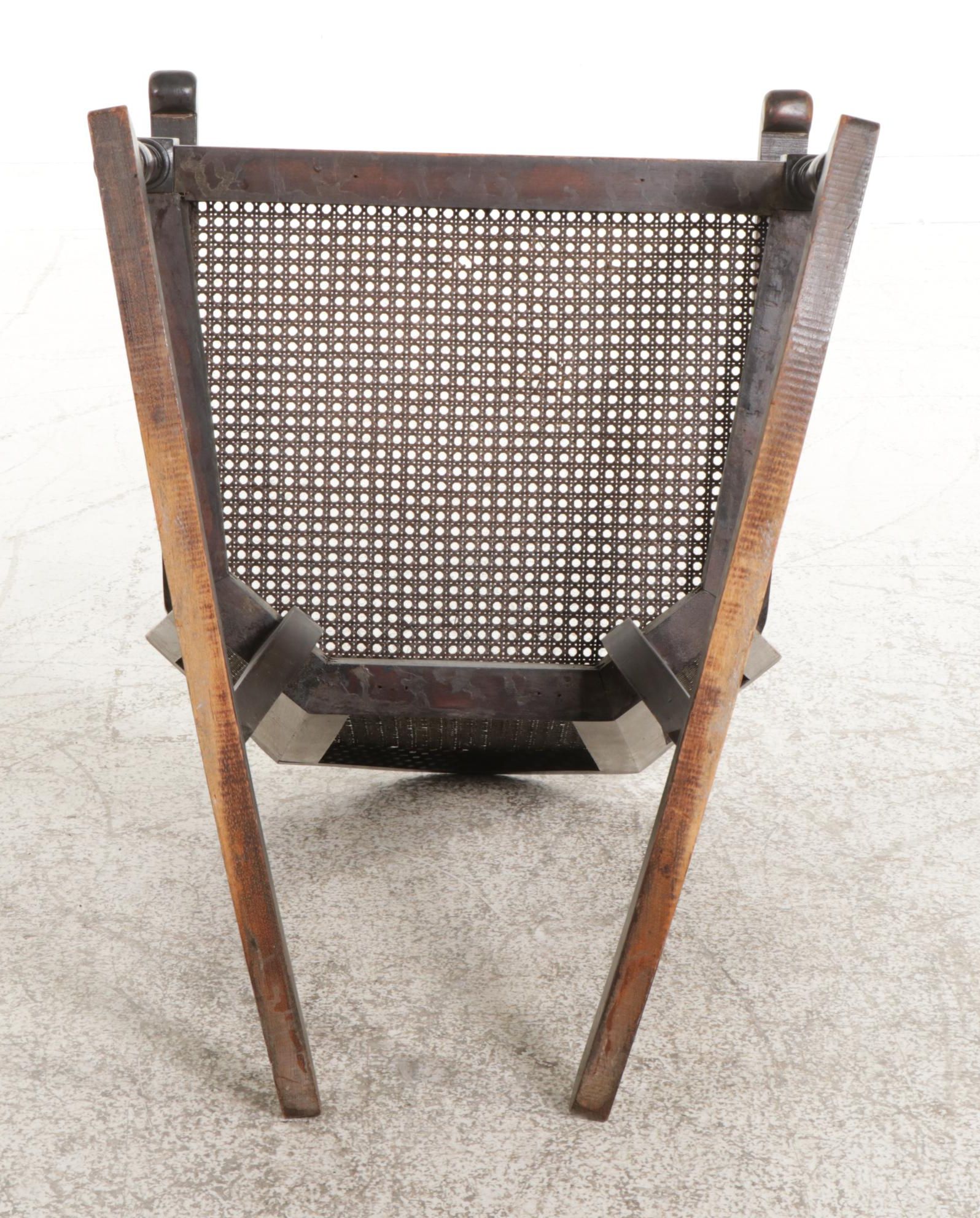 Queen Anne Style Ebonized and Caned Wingback Rocking Armchair