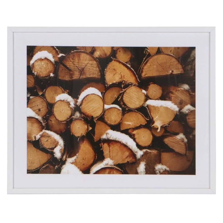 Offset Lithograph of Stacked Logs with Snow