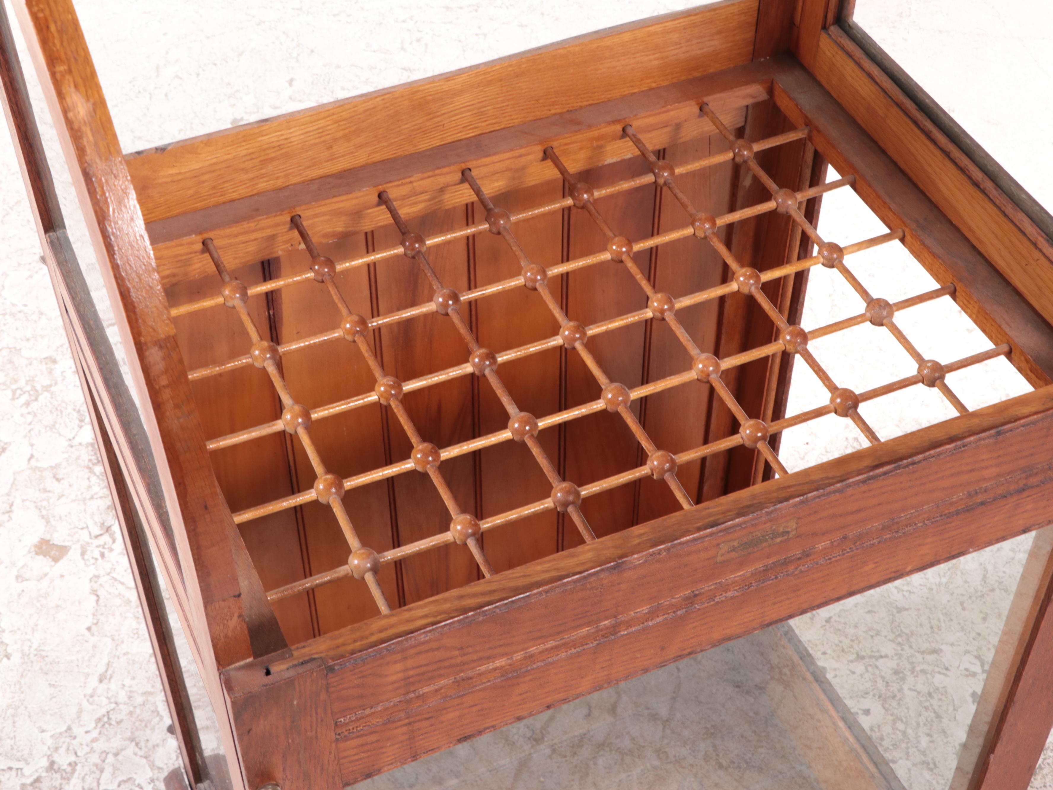 American Oak and Curved Glass Cane Display Case, circa 1900
