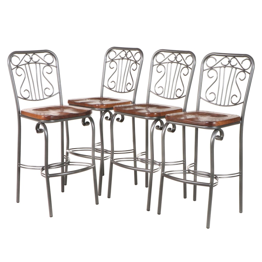 Four Patinated Metal and Oak Bar Stools