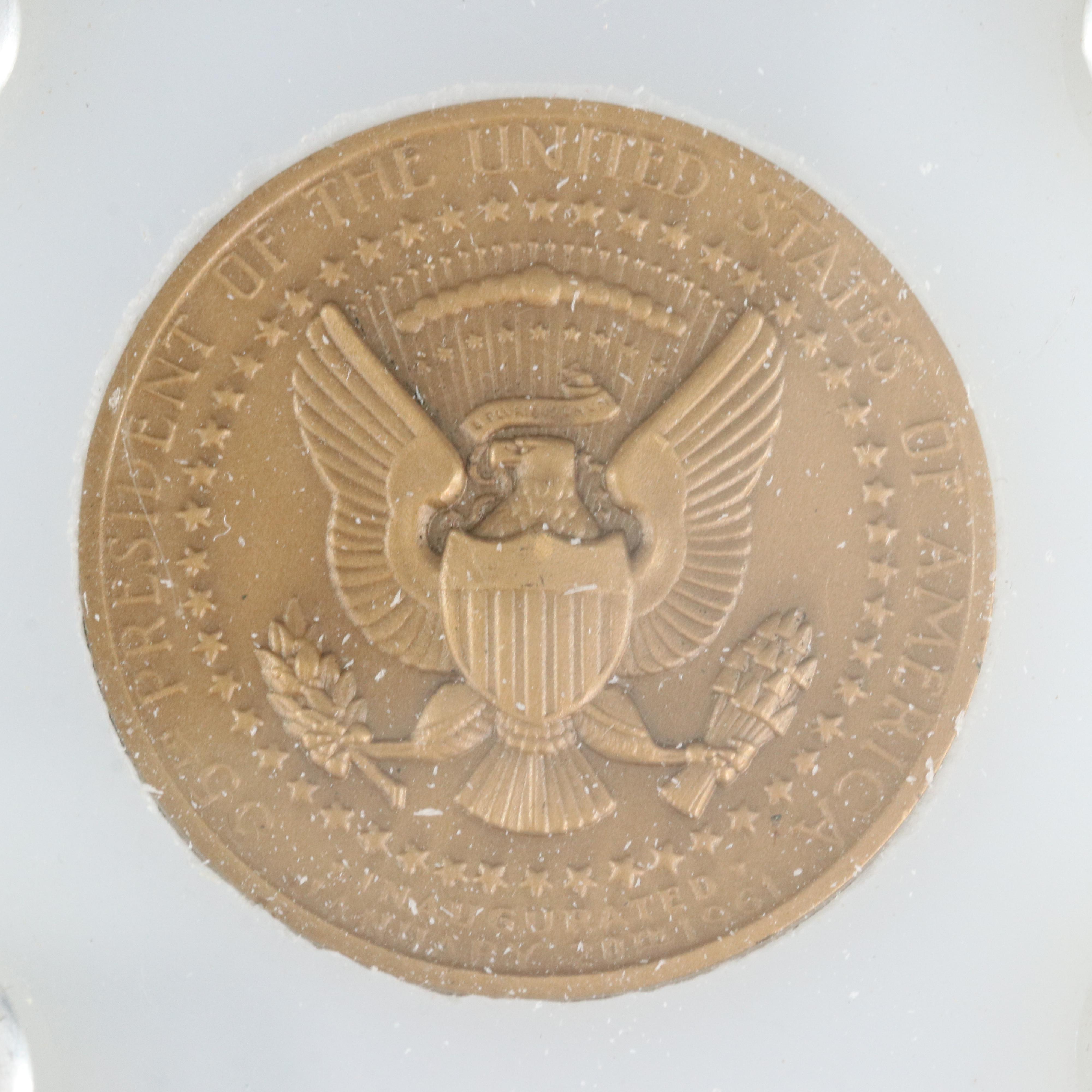 Four Presidential Bronze Medals