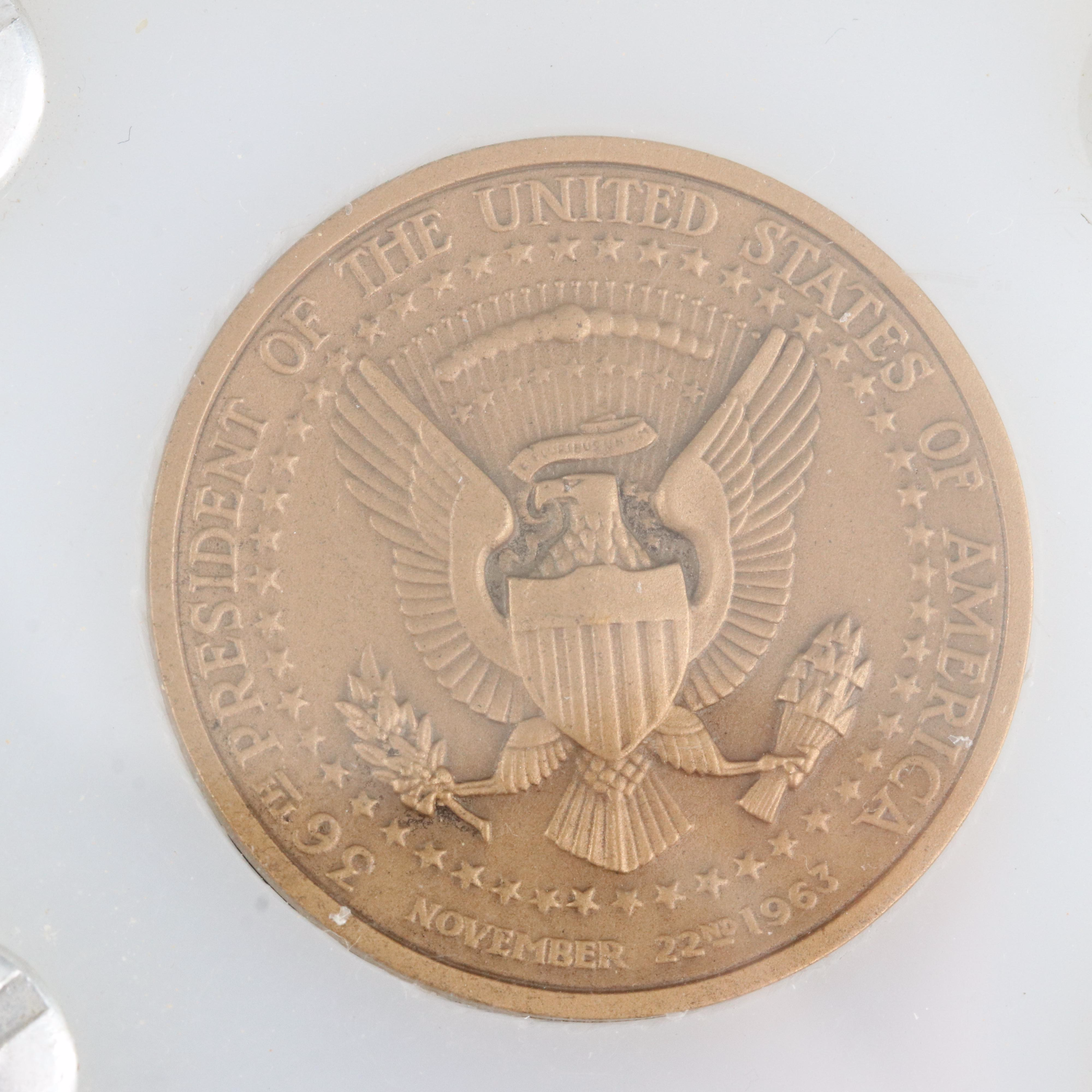 Four Presidential Bronze Medals