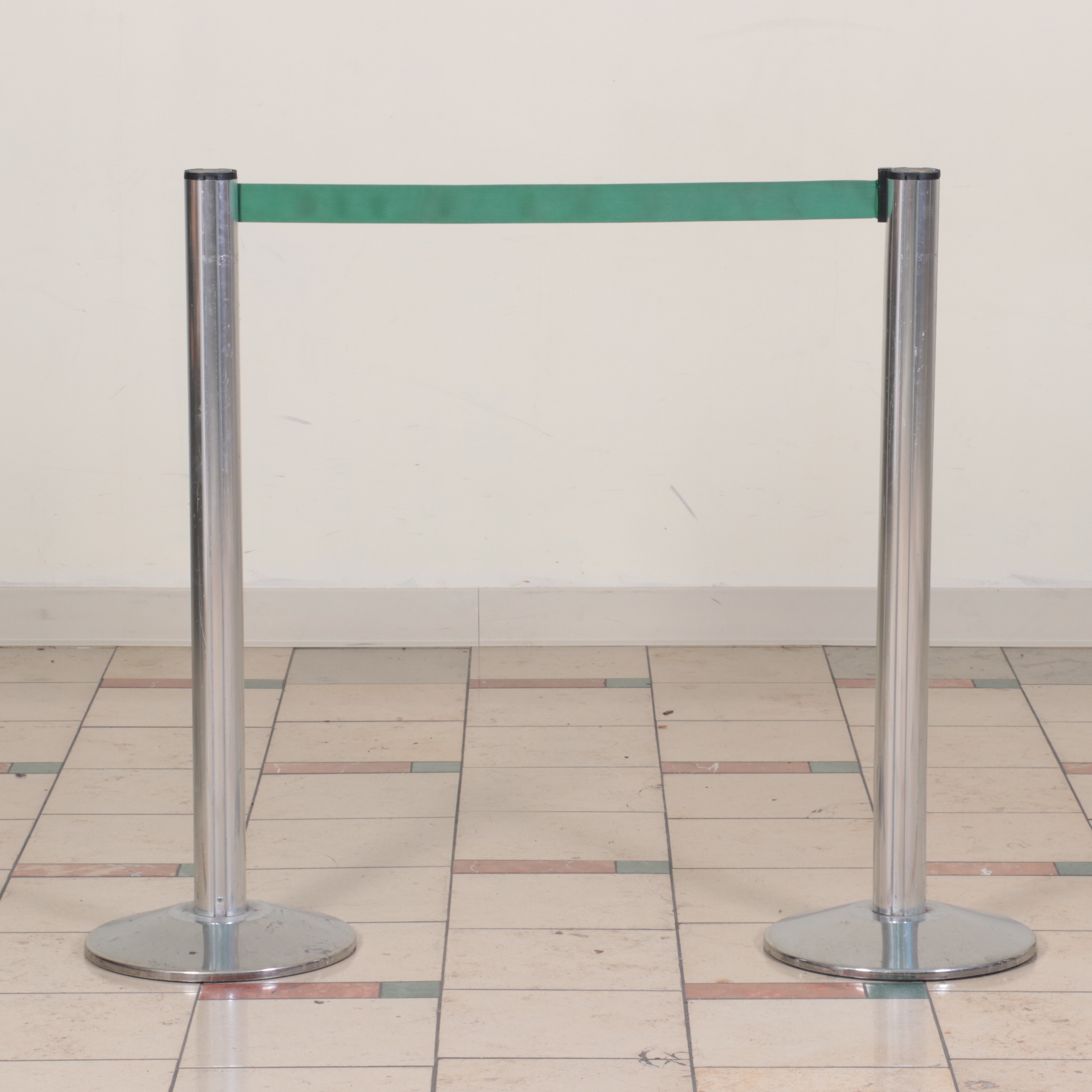 Beltrac Retractable Belt Stanchions with Green and Black Belts