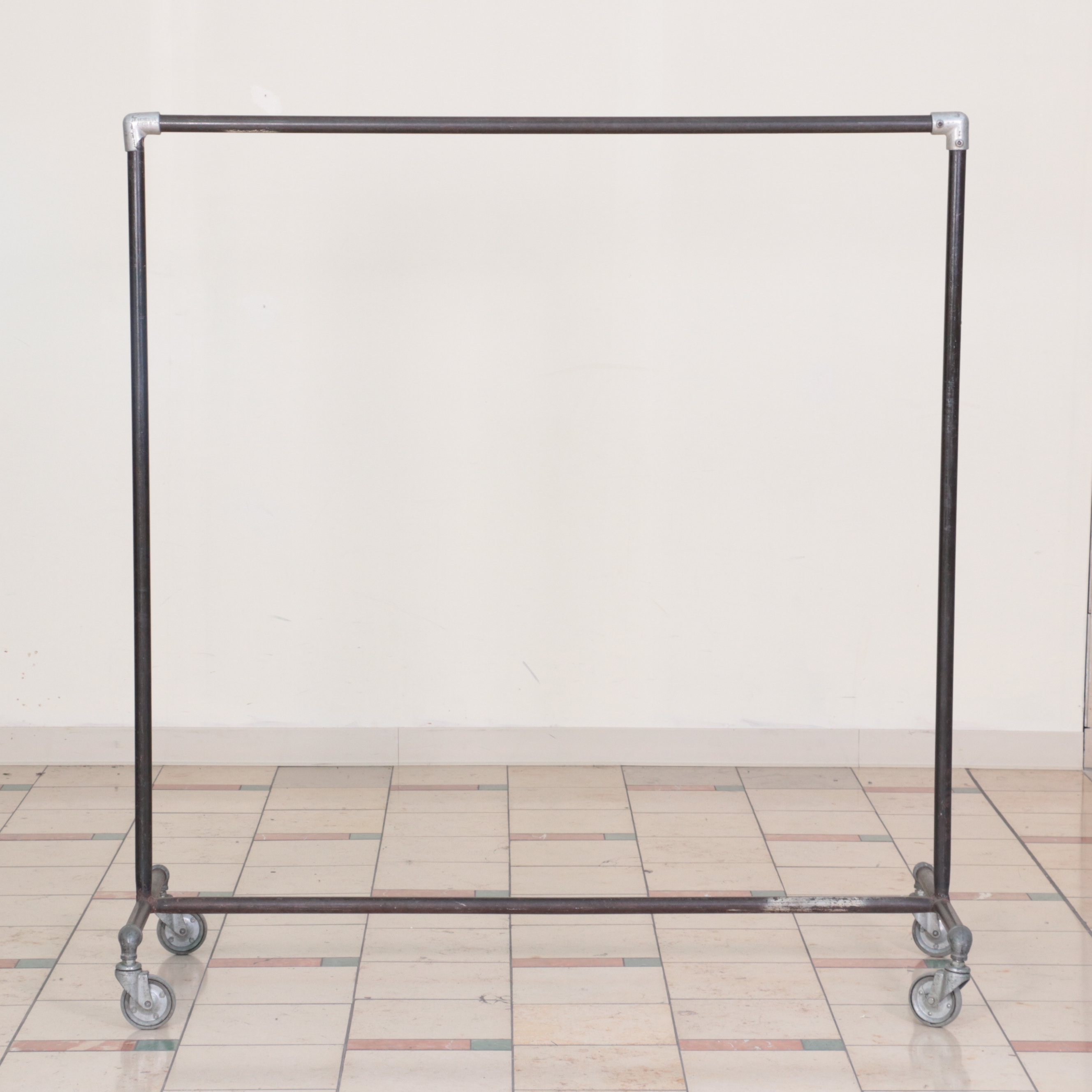 Three Metal Rolling Clothing Display Racks