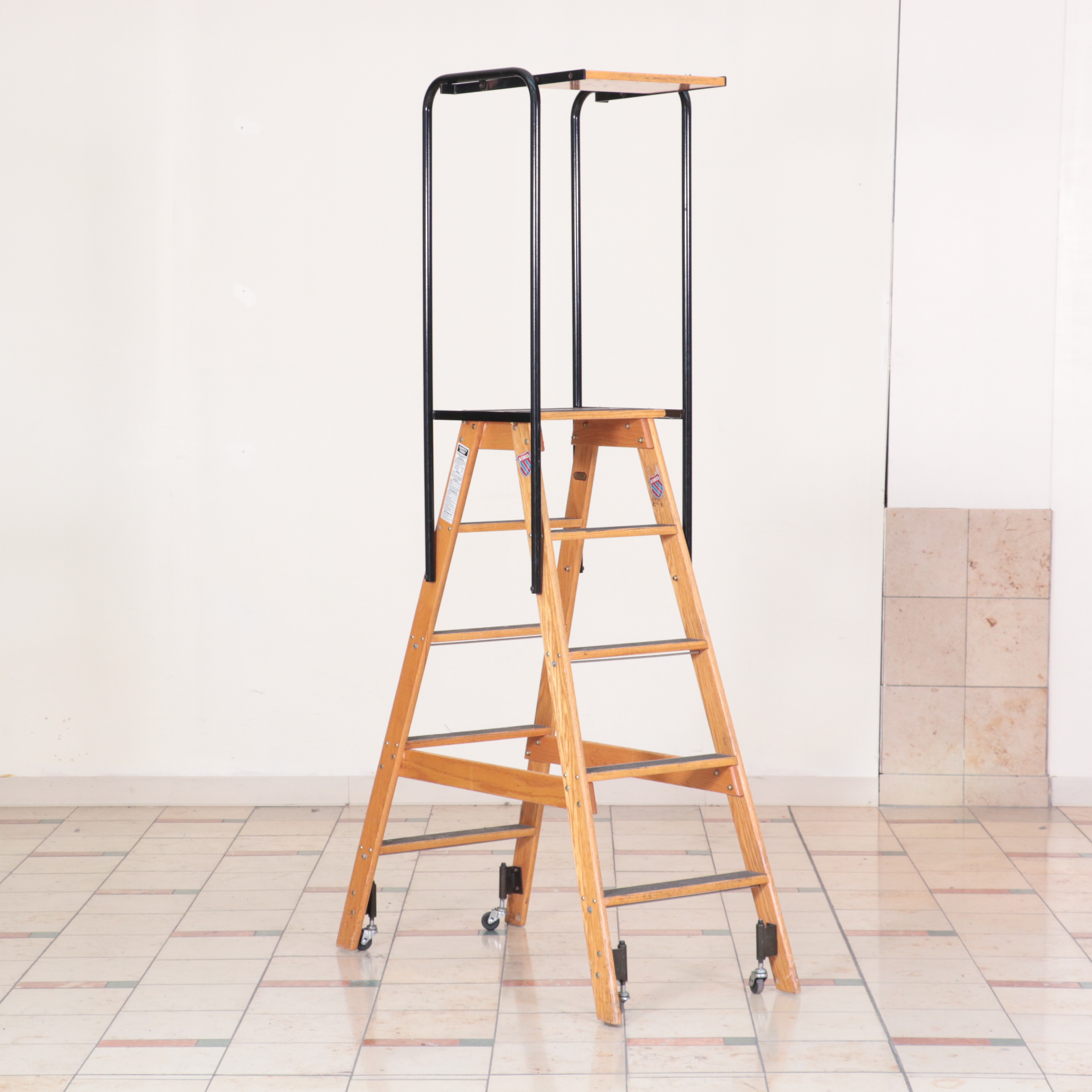Pair of Putnam Finished Wood and Metal Rolling Ladders
