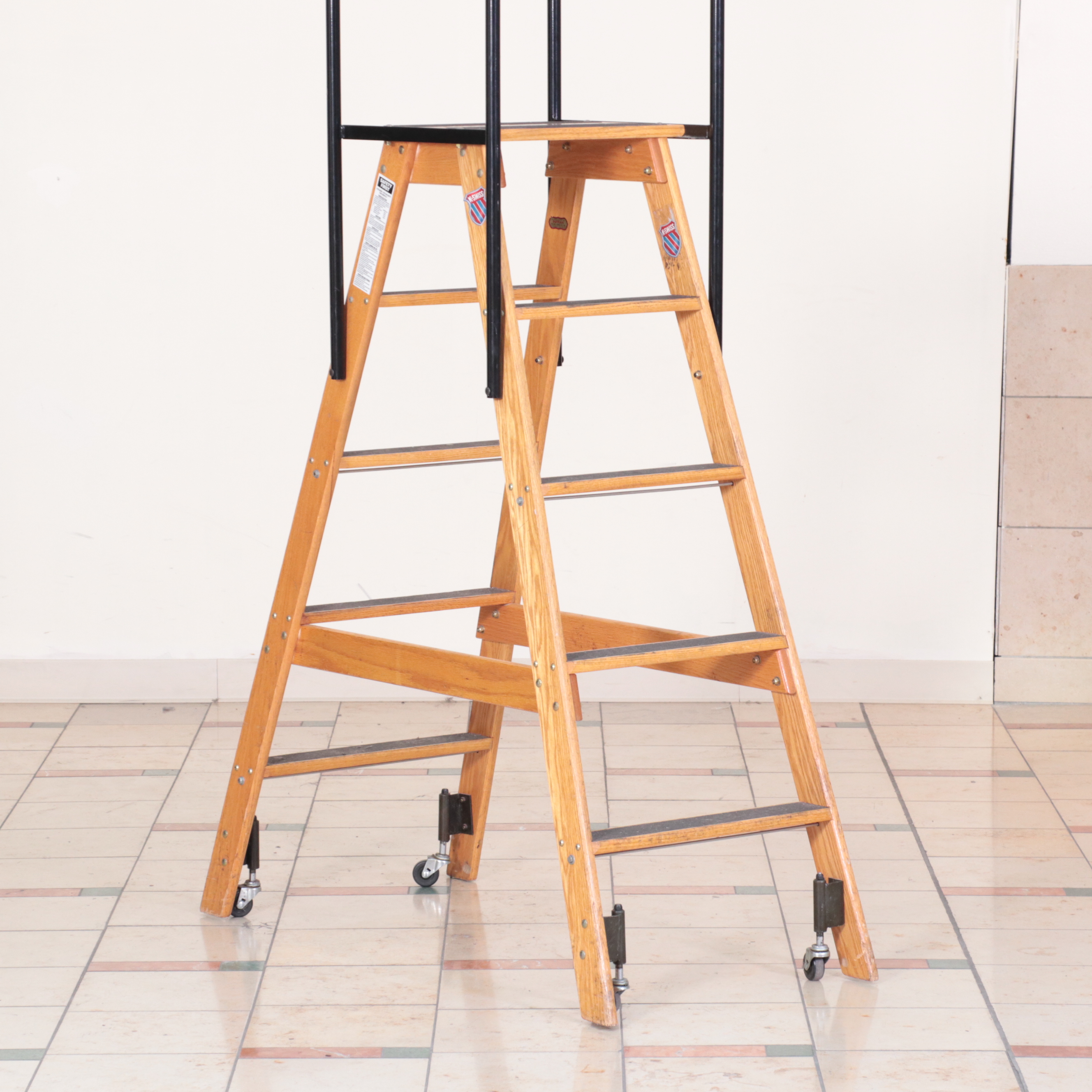 Pair of Putnam Finished Wood and Metal Rolling Ladders