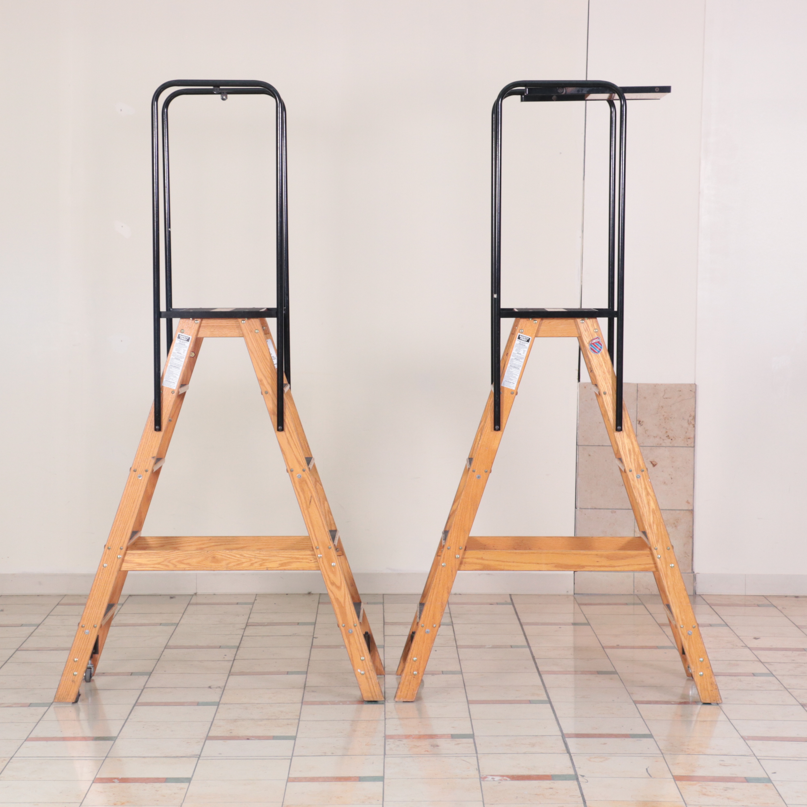 Pair of Putnam Finished Wood and Metal Rolling Ladders