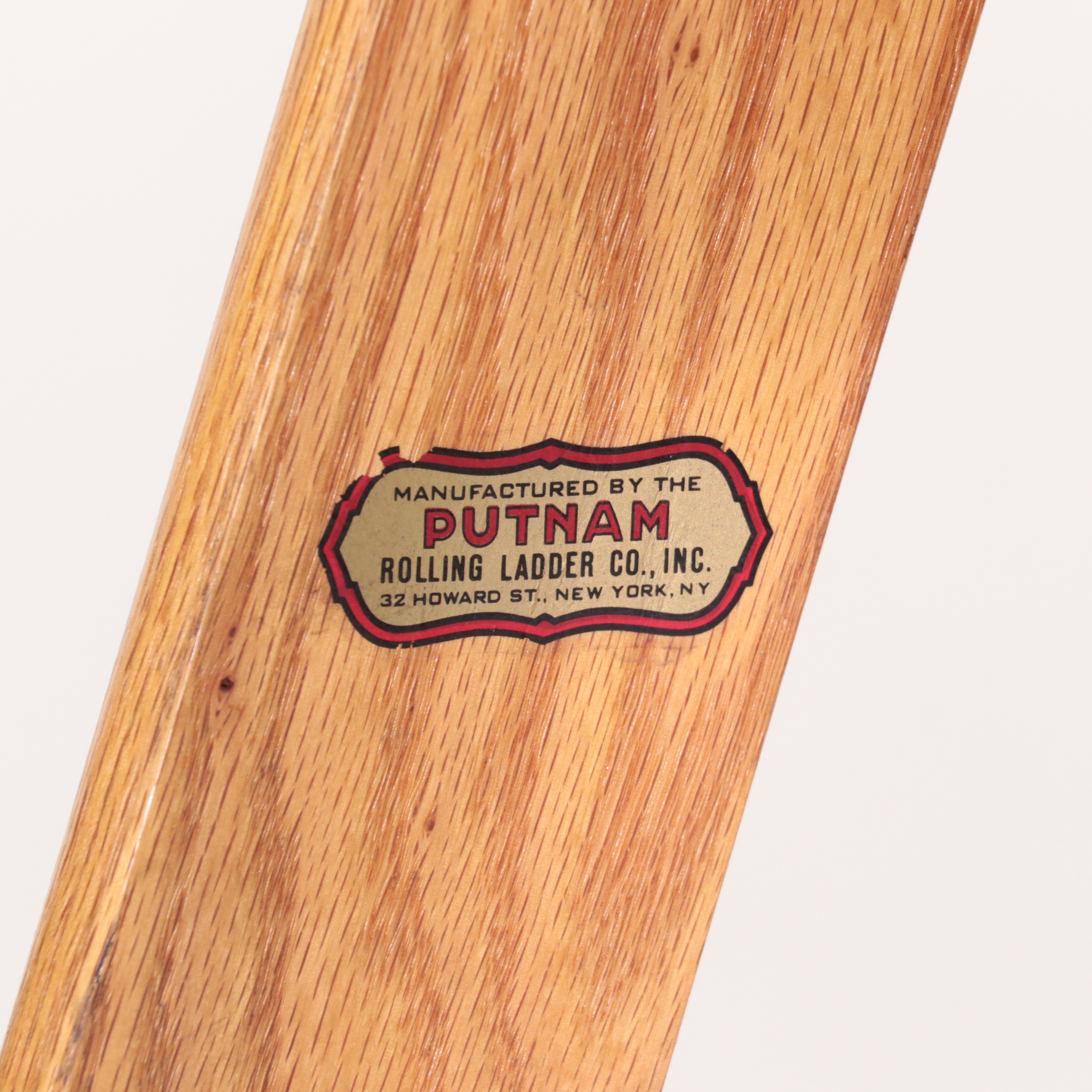 Pair of Putnam Finished Wood and Metal Rolling Ladders