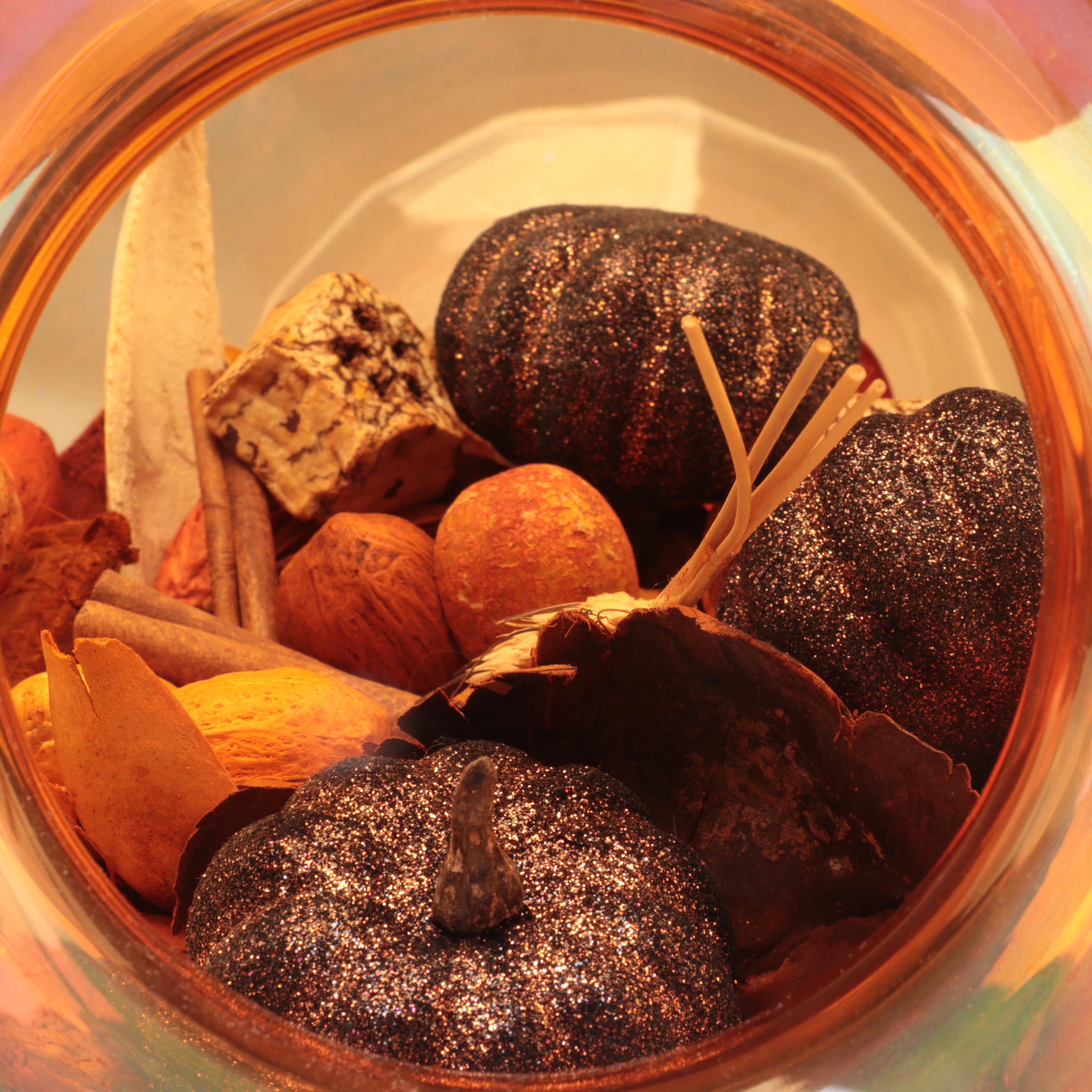 Orange Tinted Glass Vase with Potpourri and Other Glass Décor