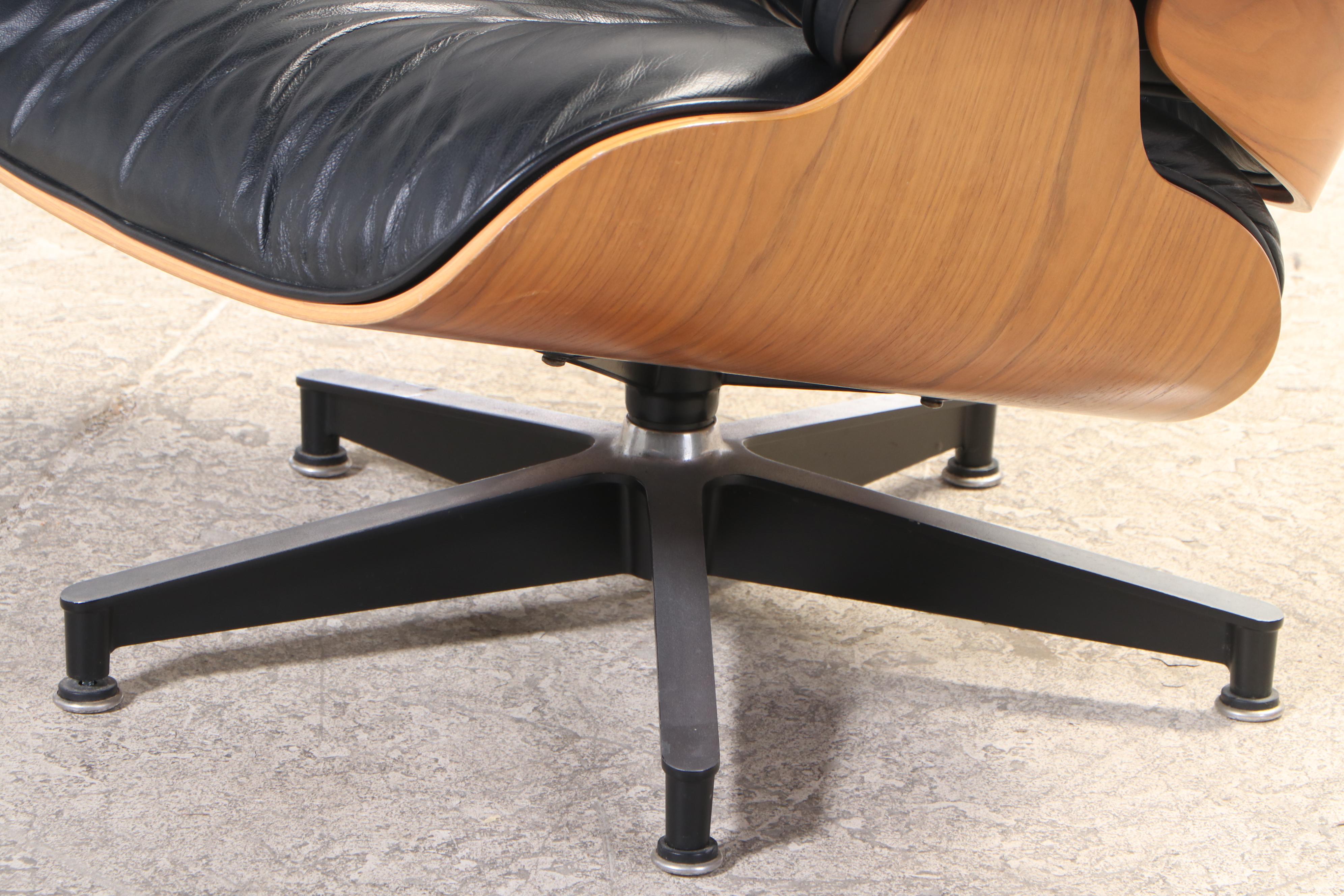 Eames for Herman Miller Laminated Walnut Lounge Chair and Ottoman, dated 2000