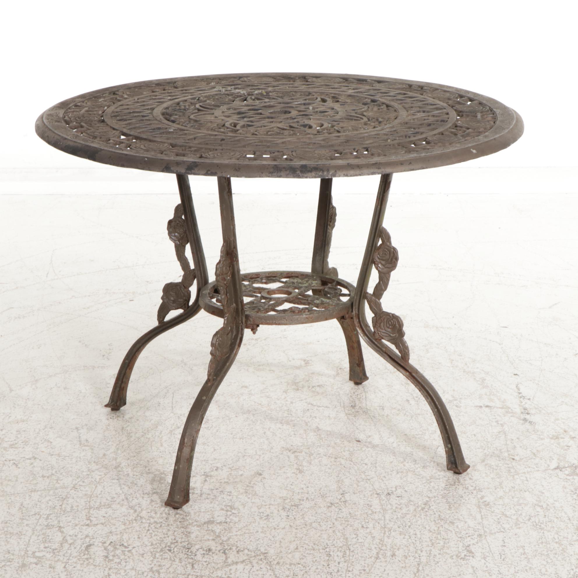 Cast Iron Five-Piece Patio Dining Set with Wicker Tiered Side Table