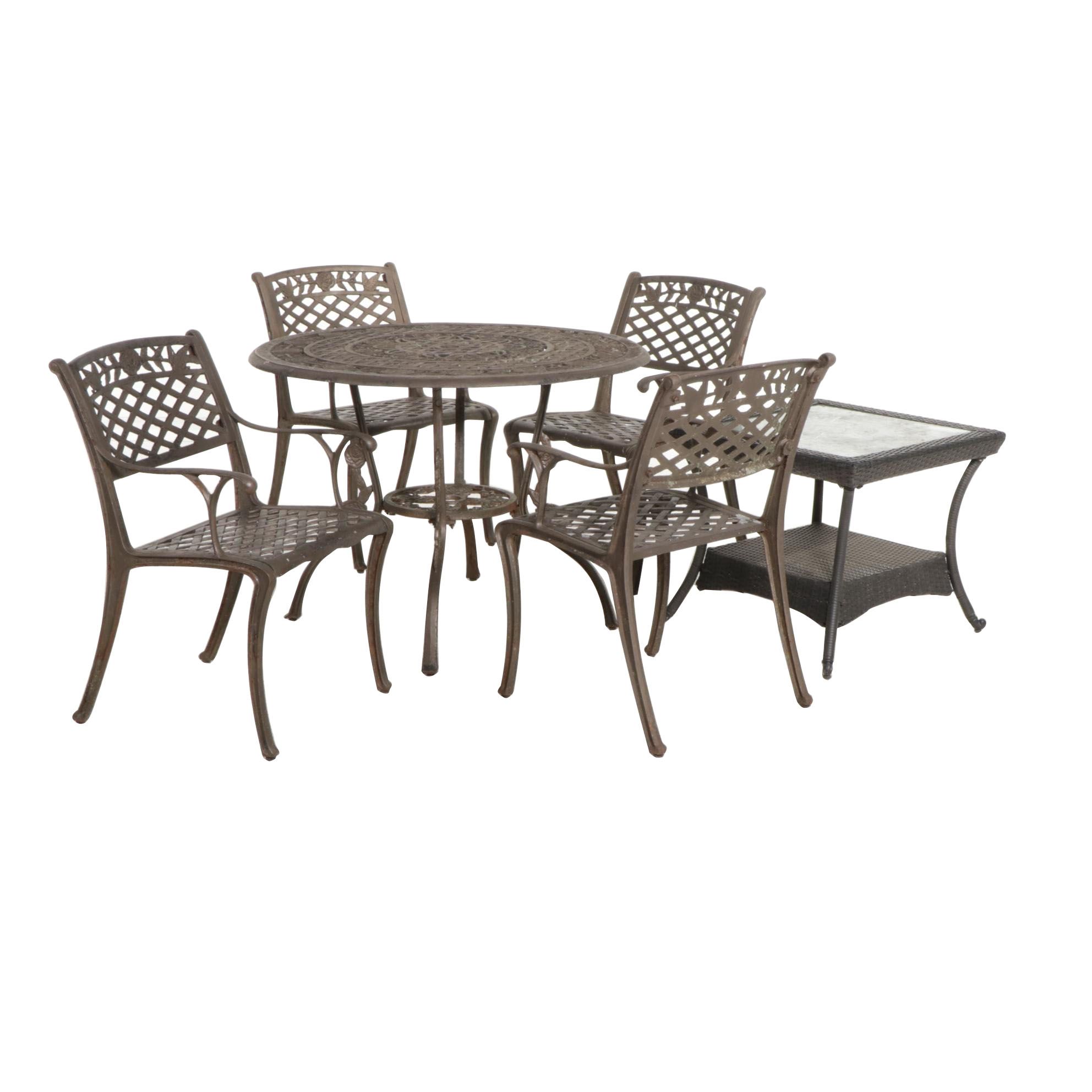 Cast Iron Five-Piece Patio Dining Set with Wicker Tiered Side Table