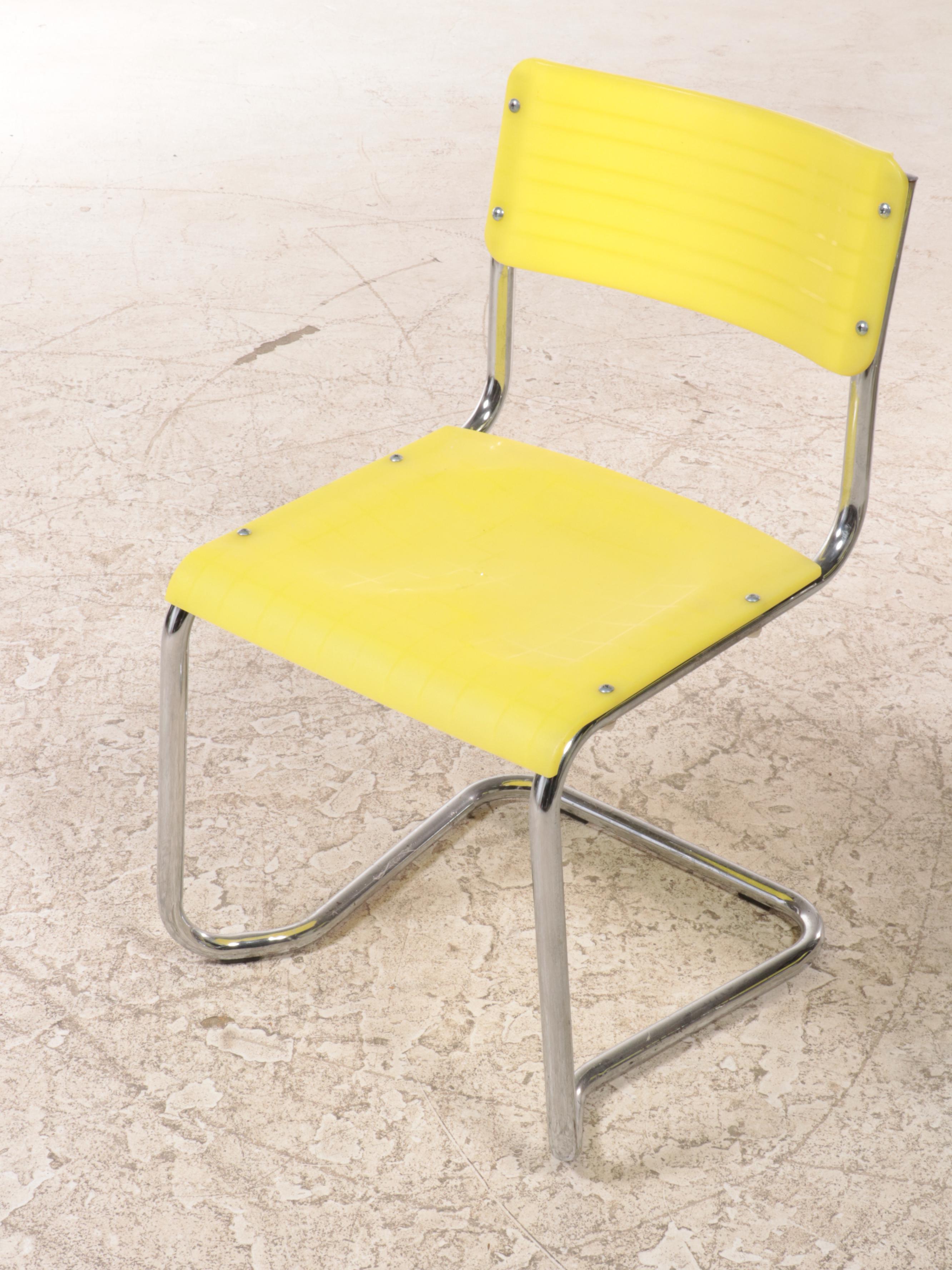 Four Italian Modernist Yellow Plastic and Chromed Metal Cantilever Side Chairs