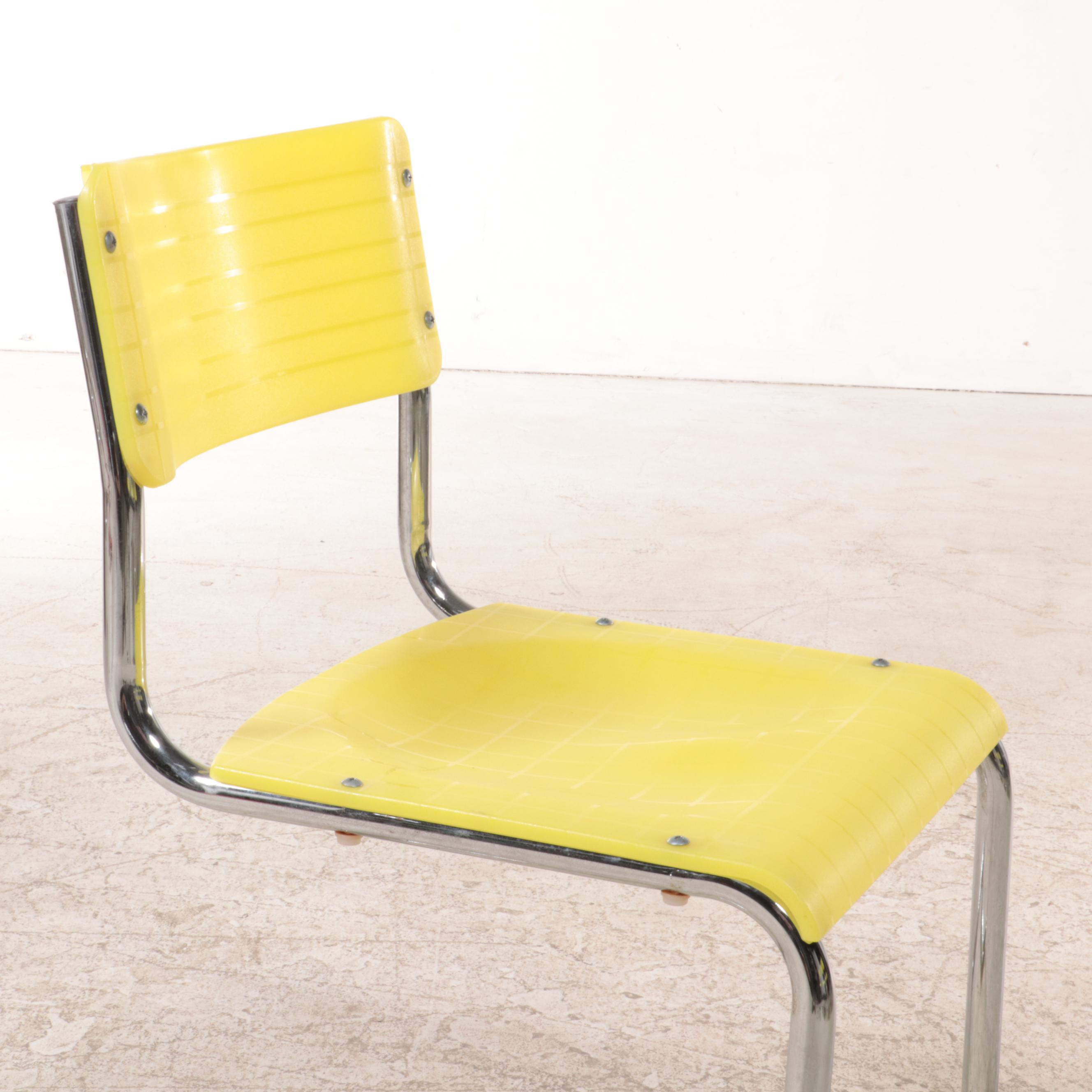 Four Italian Modernist Yellow Plastic and Chromed Metal Cantilever Side Chairs