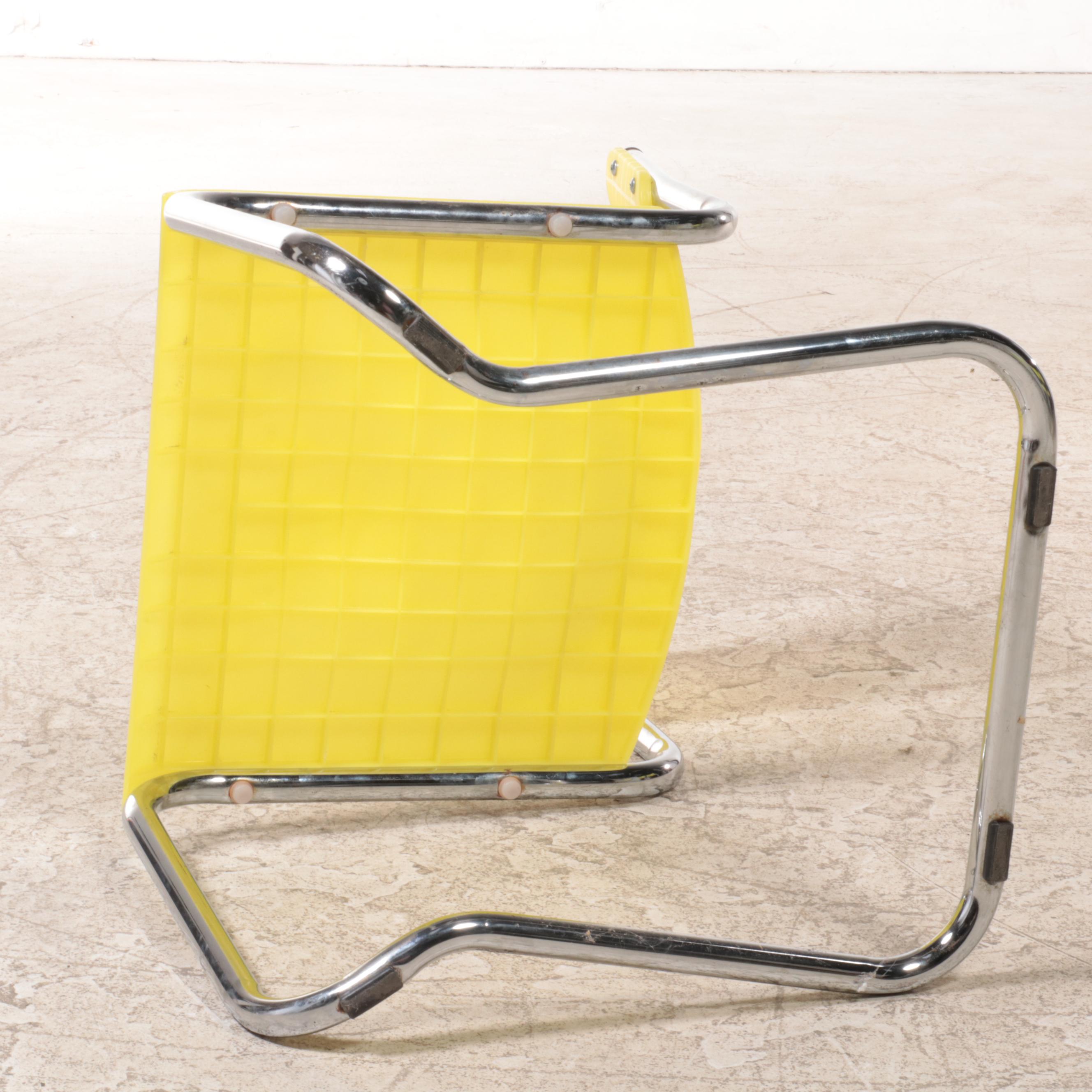 Four Italian Modernist Yellow Plastic and Chromed Metal Cantilever Side Chairs