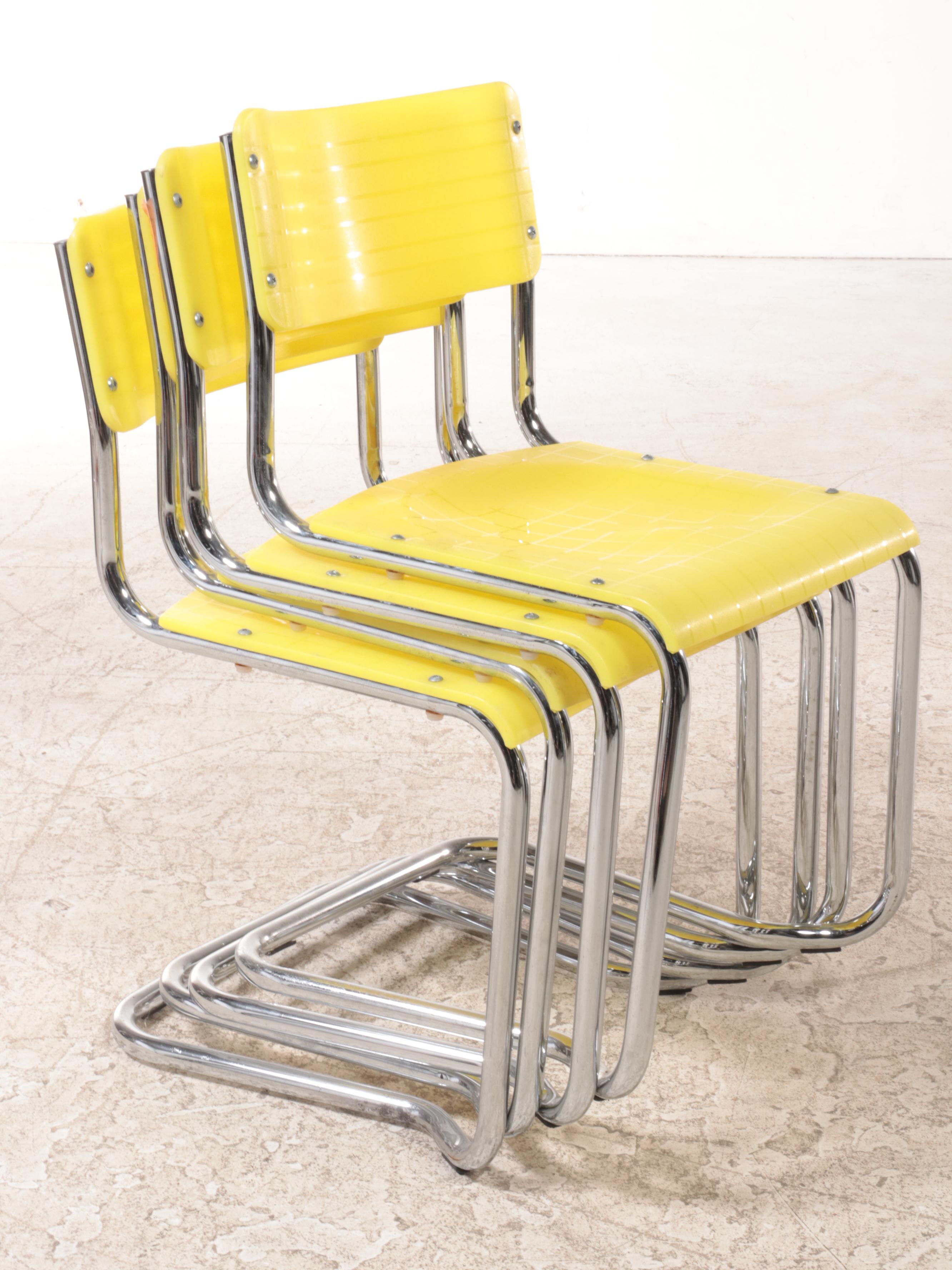 Four Italian Modernist Yellow Plastic and Chromed Metal Cantilever Side Chairs